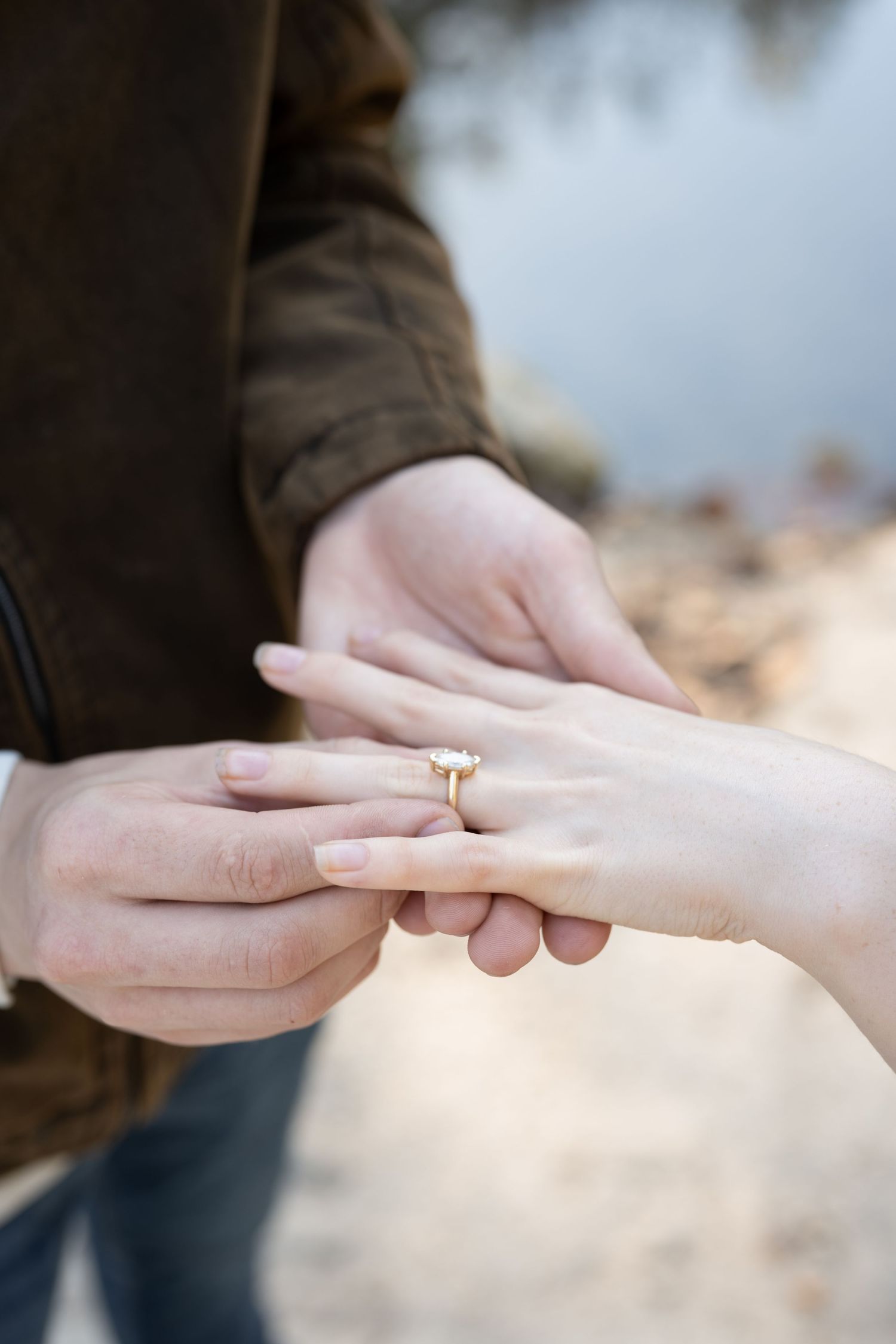 A sequence of close-up photos showing an engagement ring being placed on a finger during a romantic proposal.