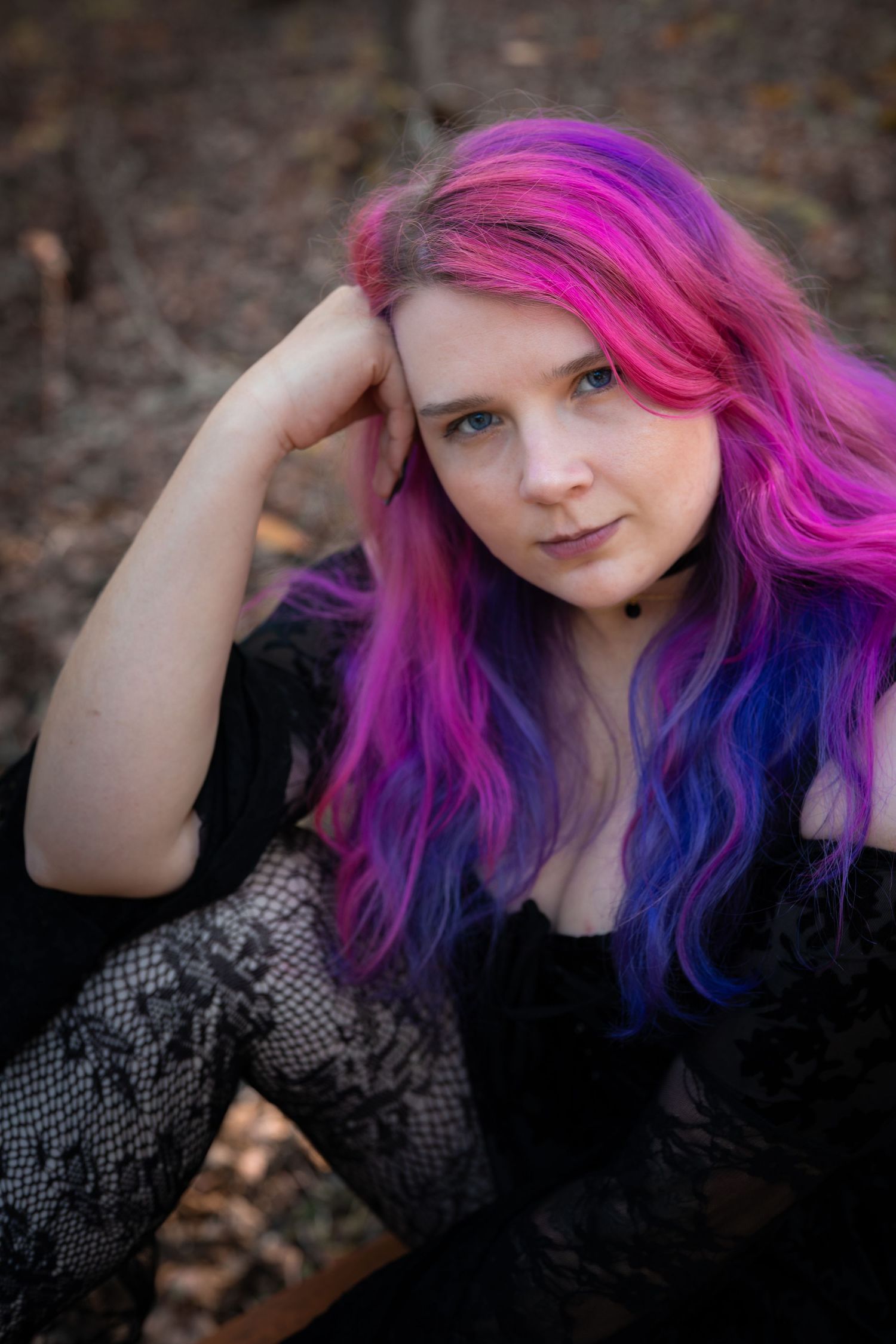Portrait series showing vibrant pink and blue dyed hair against dark autumn background in multiple poses.