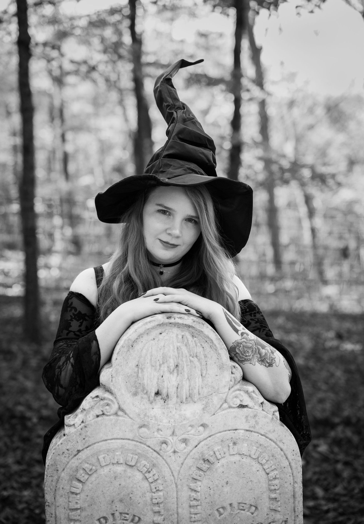 A witch in black hat poses with old cemetery headstones in a spooky forest setting, shown in multiple black and white shots.