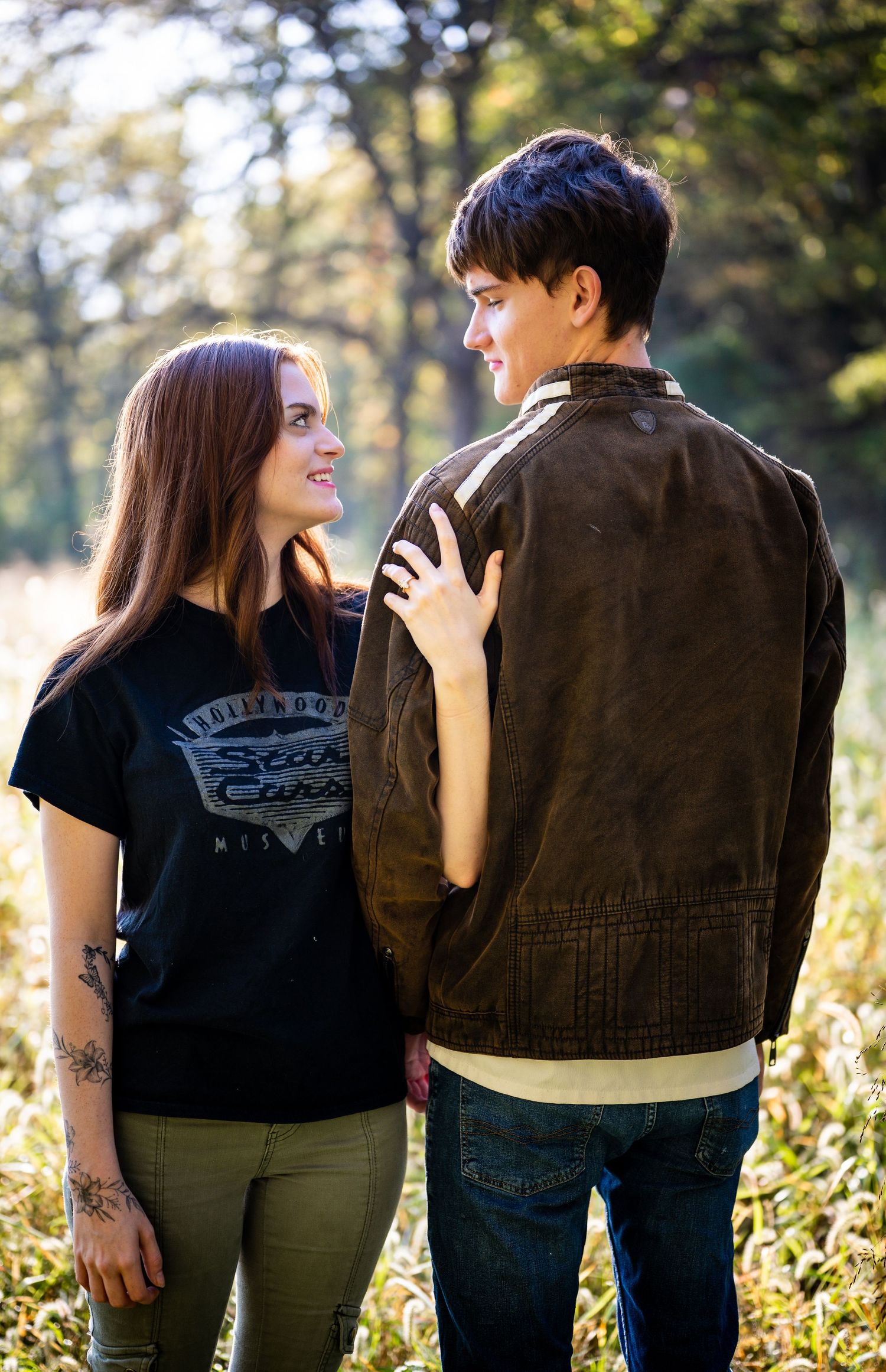 Three sequential photos of a couple in casual wear standing together outdoors in sunlit greenery.