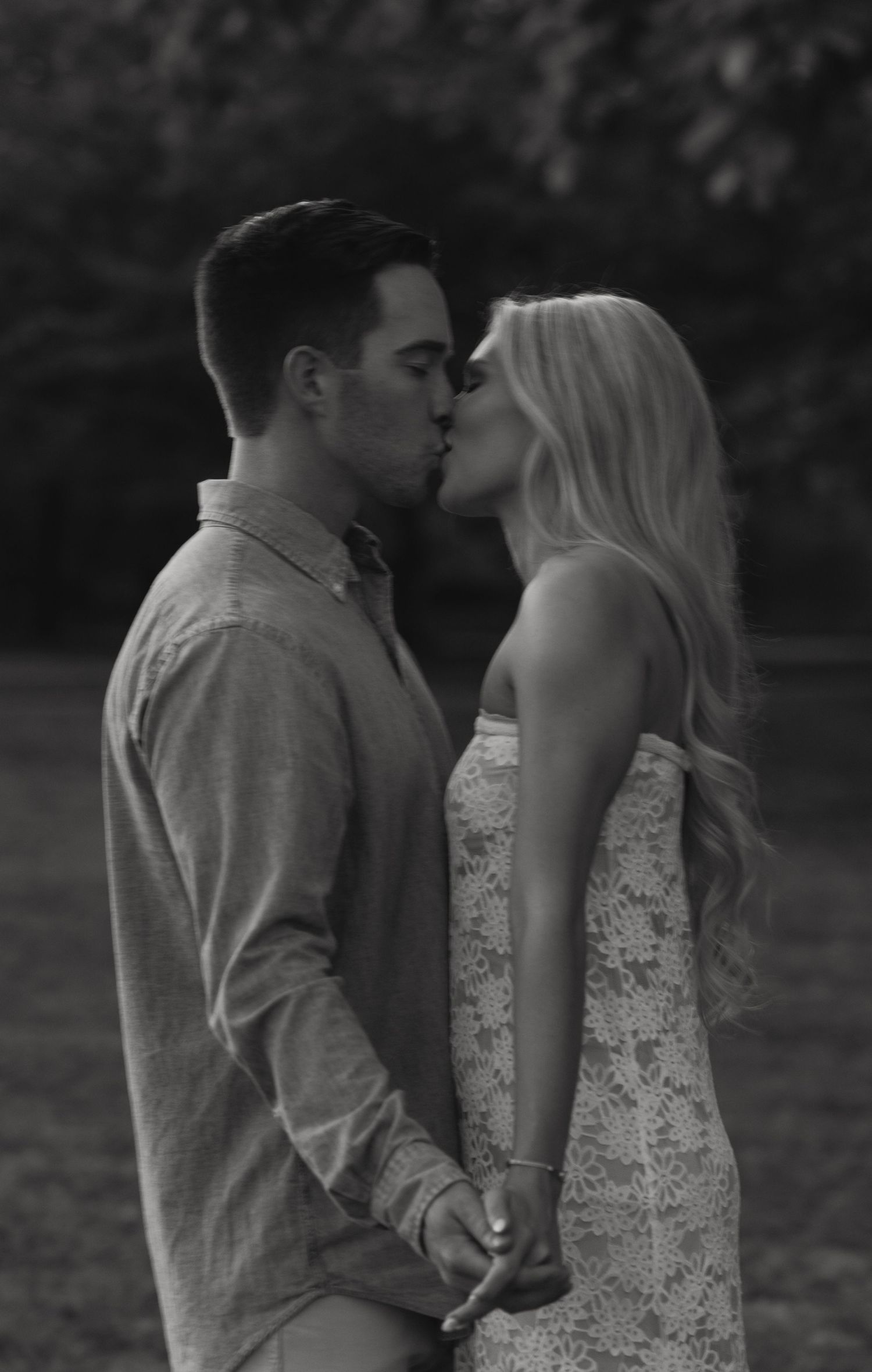 A romantic black and white photo sequence shows a couple in an intimate moment outdoors.