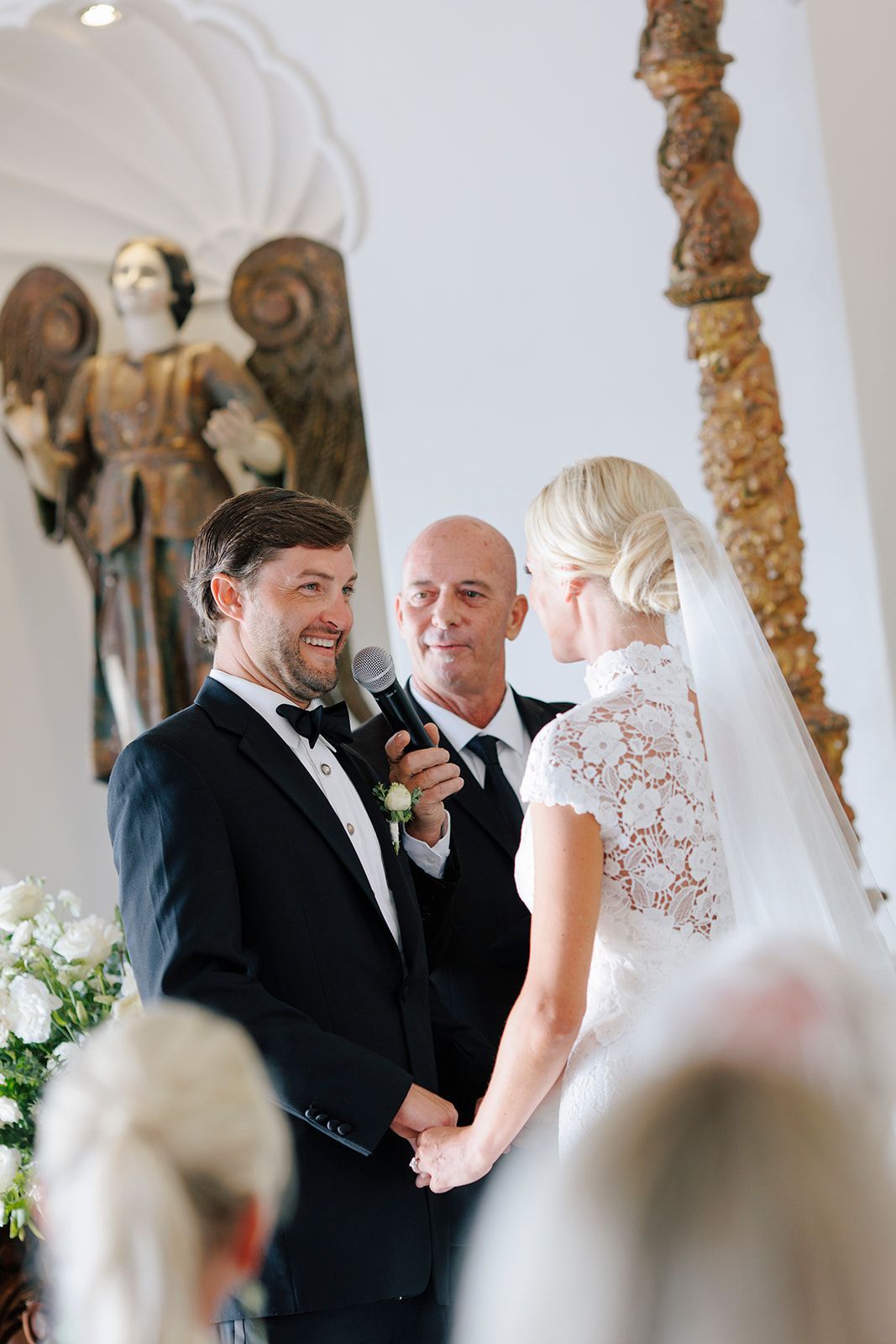 Couple exchange emotional vows inside a romantic chapel during an intimate wedding in Puerto Vallarta, by José Carrillo Photography.