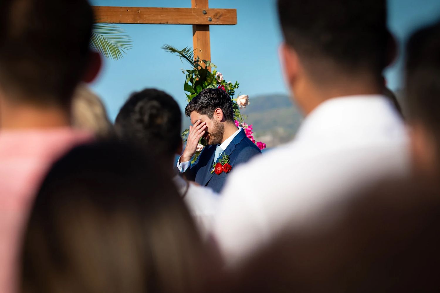 Groom wipes away tears during the ceremony in Puerto Vallarta, captured with emotion and artistry by wedding photographer José Carrillo.