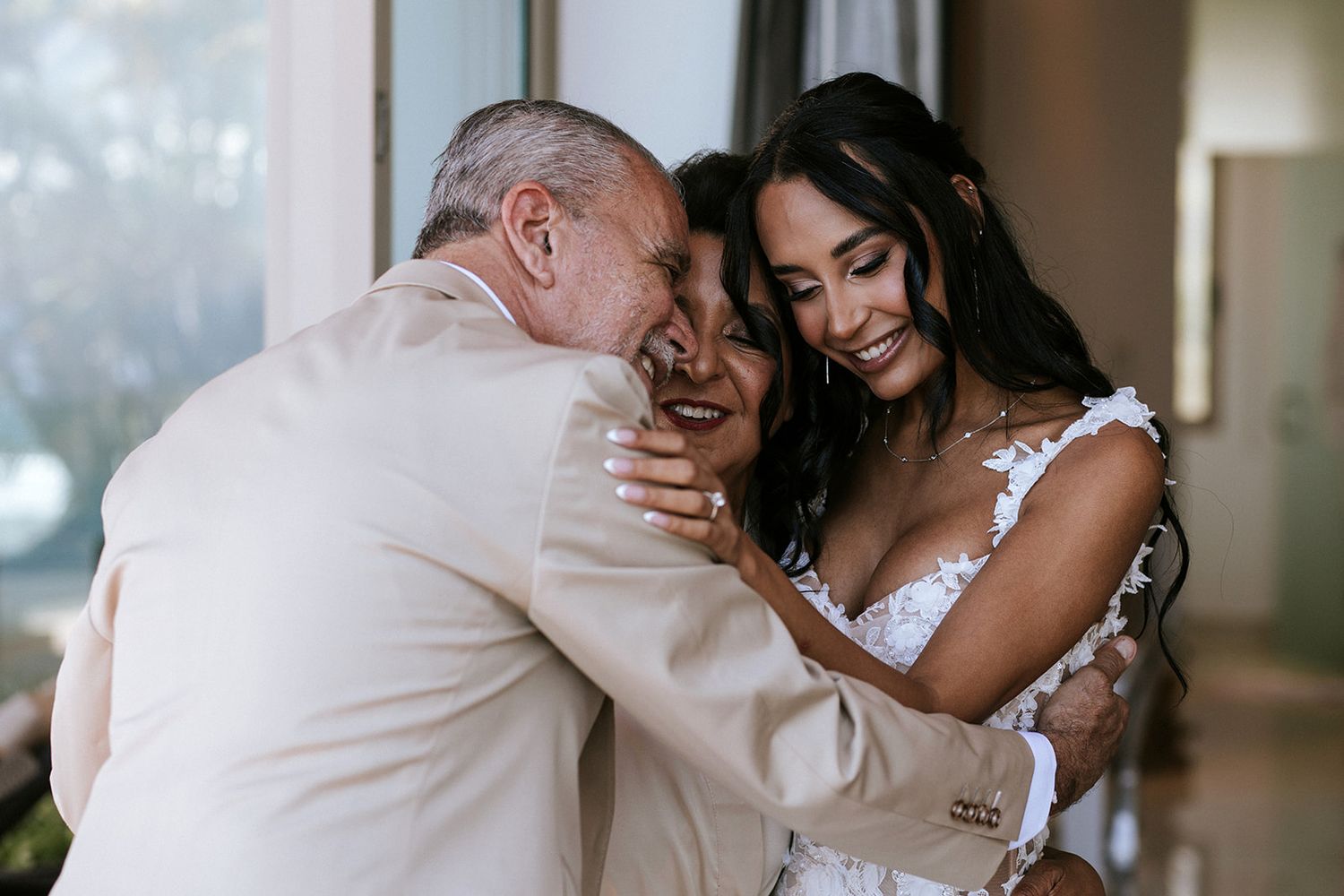 Bride embraces her parents before the ceremony in Puerto Vallarta, captured with warmth and authenticity by wedding photographer José Carril