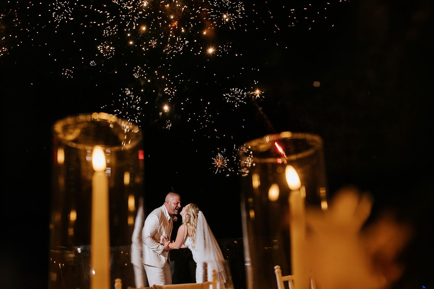 Bride and groom under fireworks at Dreams Bahia Mita wedding in Riviera Nayarit