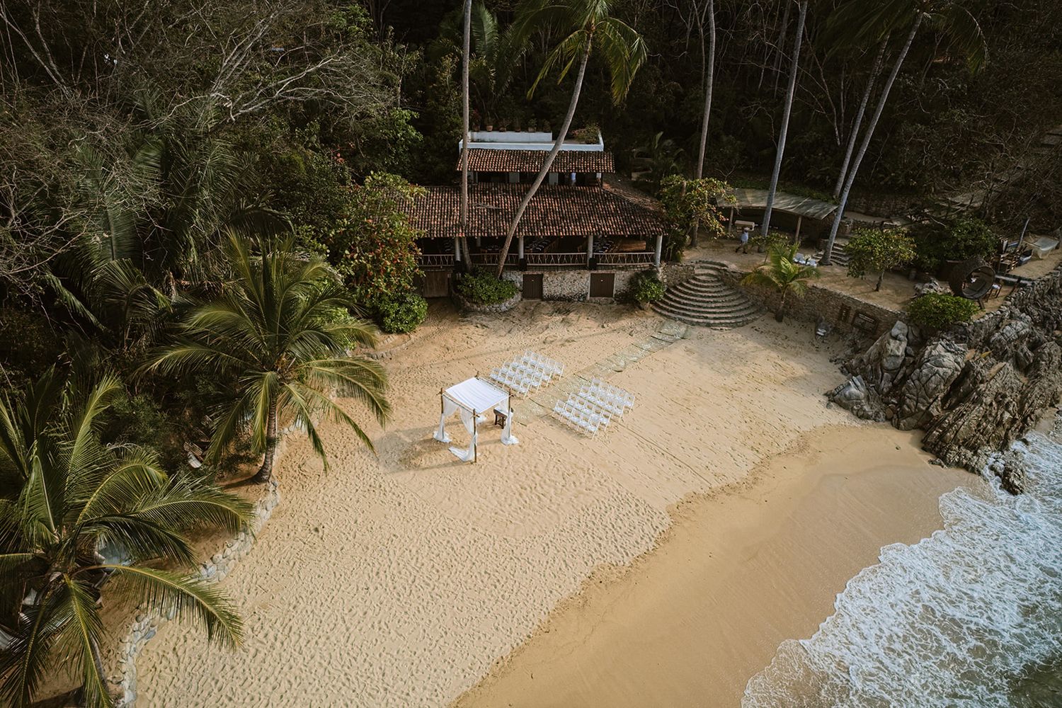 Aerial view of a beachfront wedding ceremony at Las Caletas near Puerto Vallarta