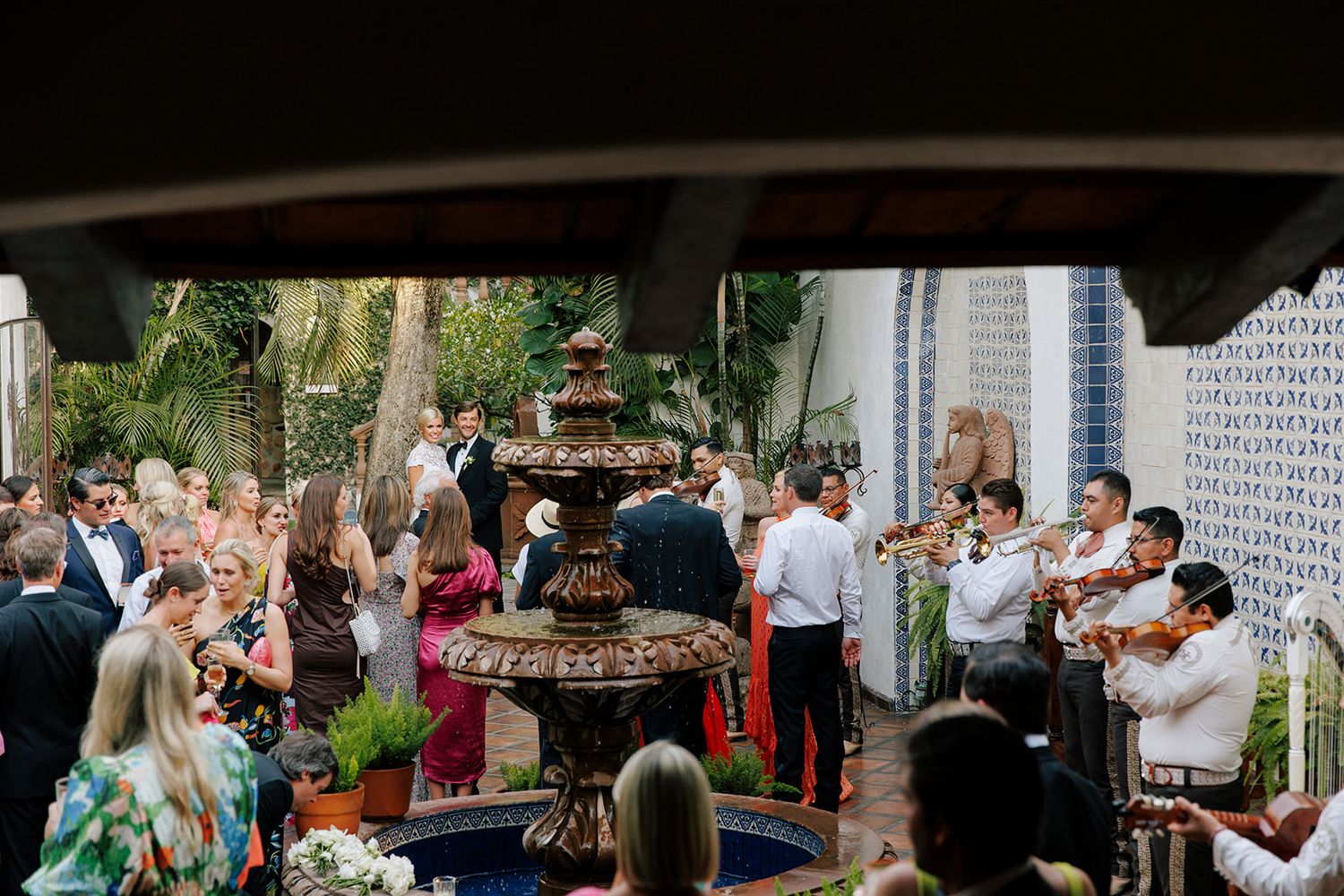 Guests celebrate with mariachi music during a lively hacienda-style wedding reception in Puerto Vallarta, by José Carrillo Photography.
