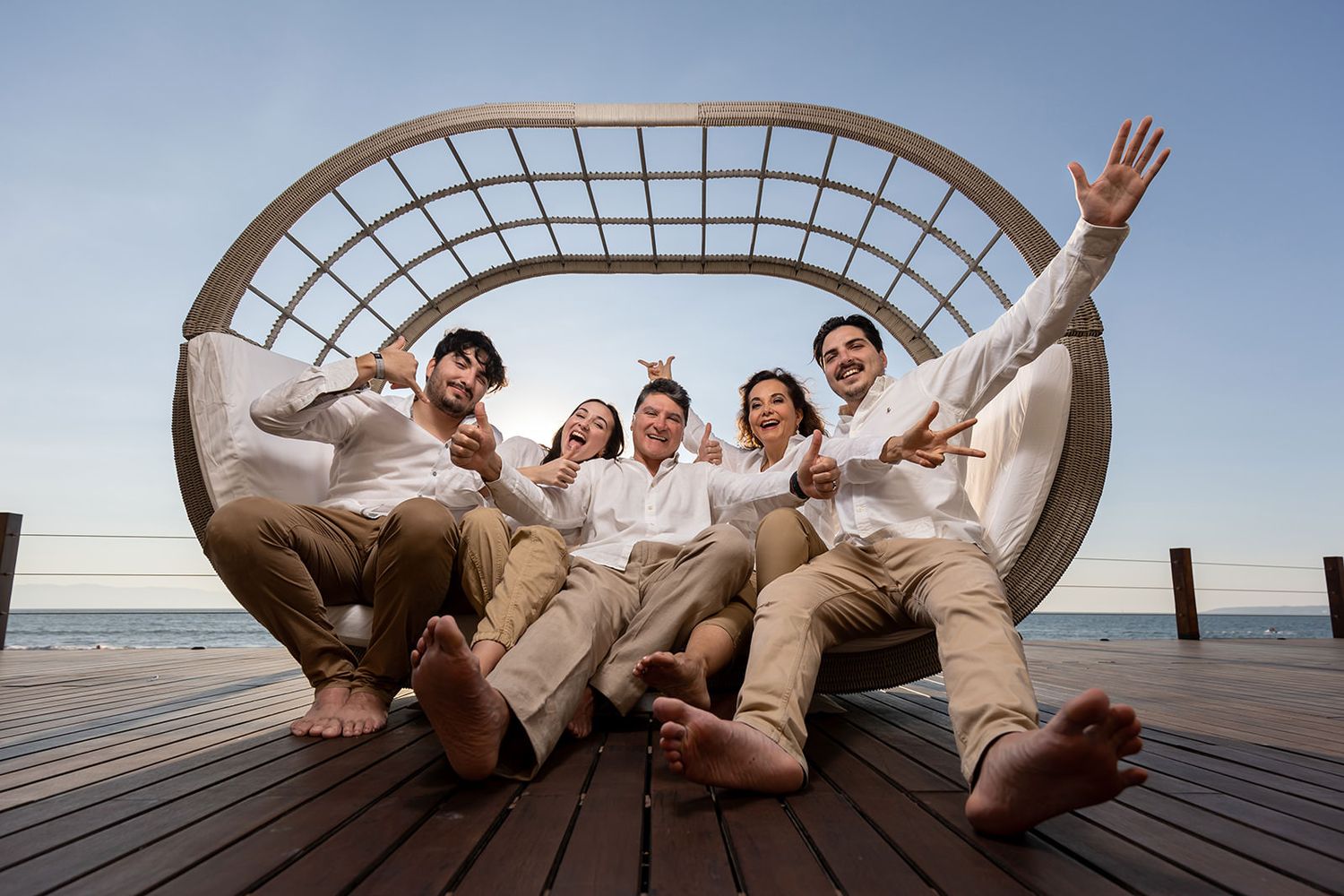 Family laughing together during a relaxed photo session at Luma Nuevo Vallarta