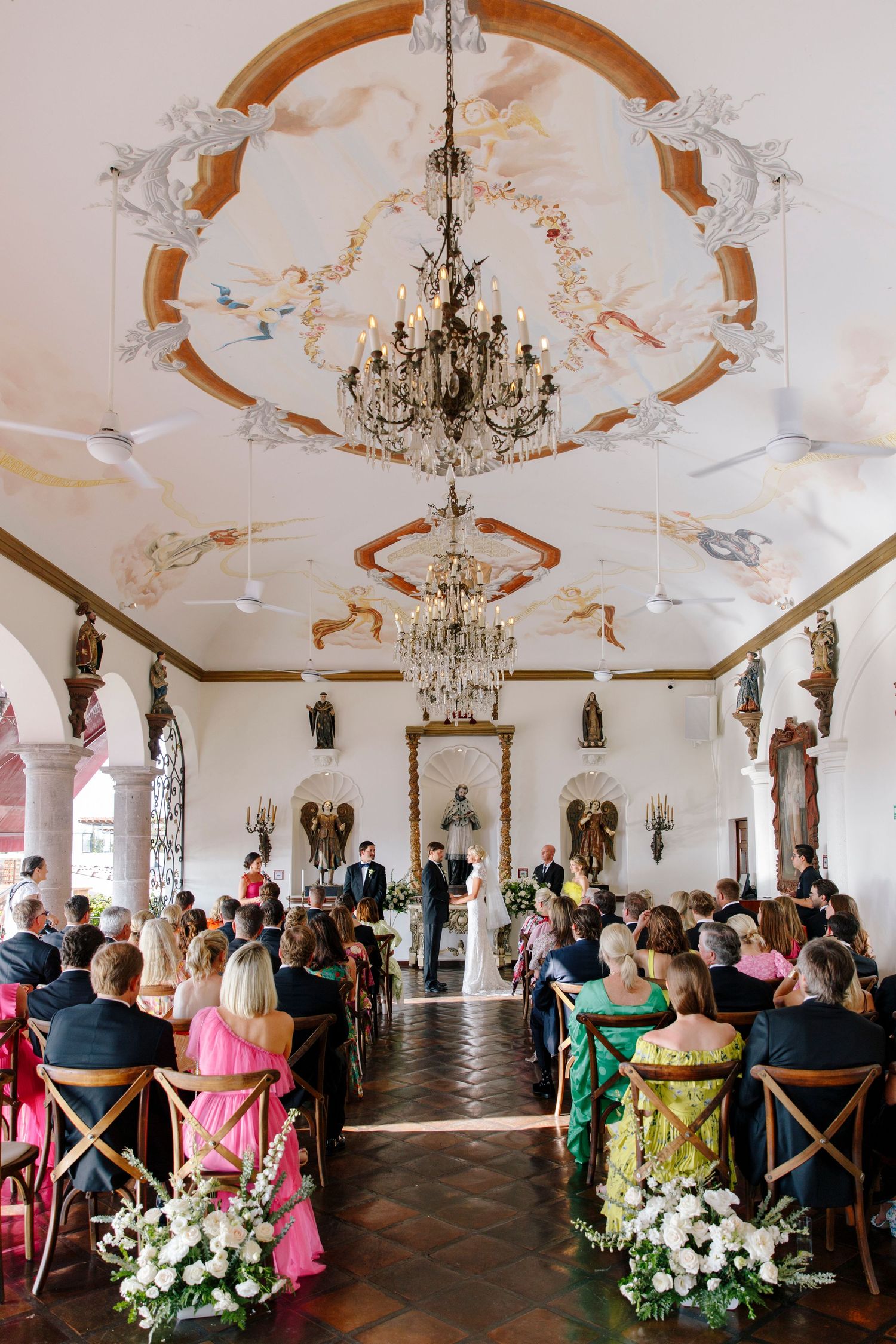 Elegant wedding ceremony at La Capella Puerto Vallarta, surrounded by ornate architecture and natural light, by José Carrillo Photography.