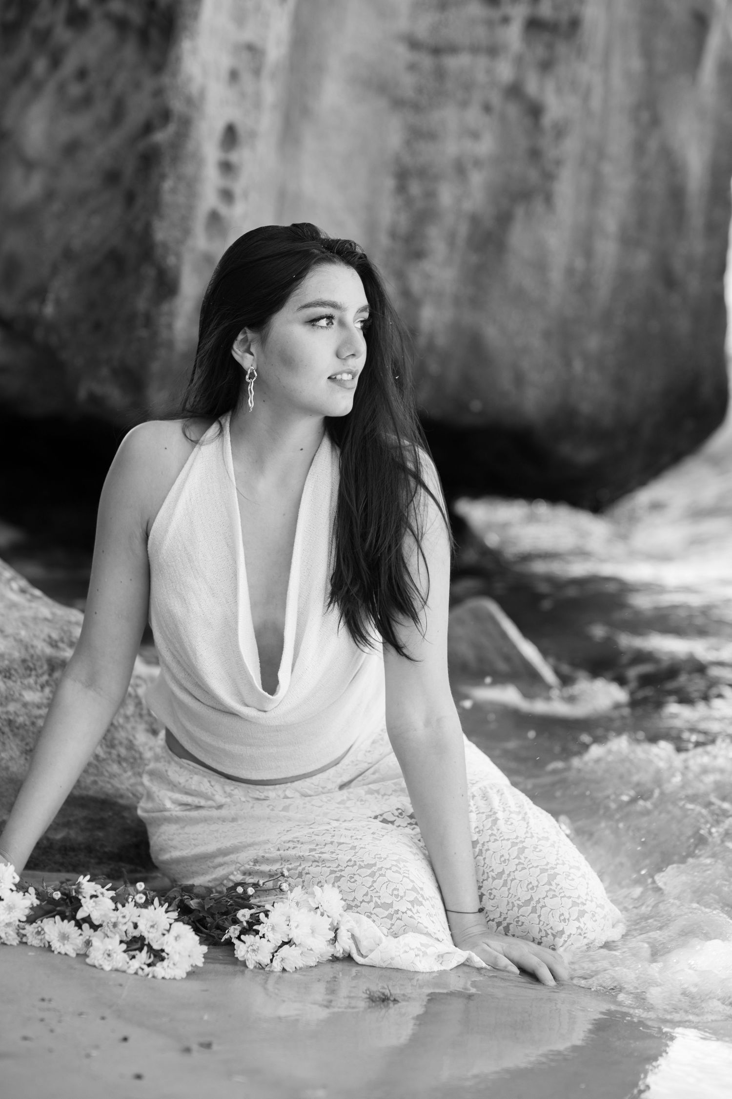 Environmental portrait of a woman seated by the shoreline at Milk Beach in Sydney's Eastern Suburbs.