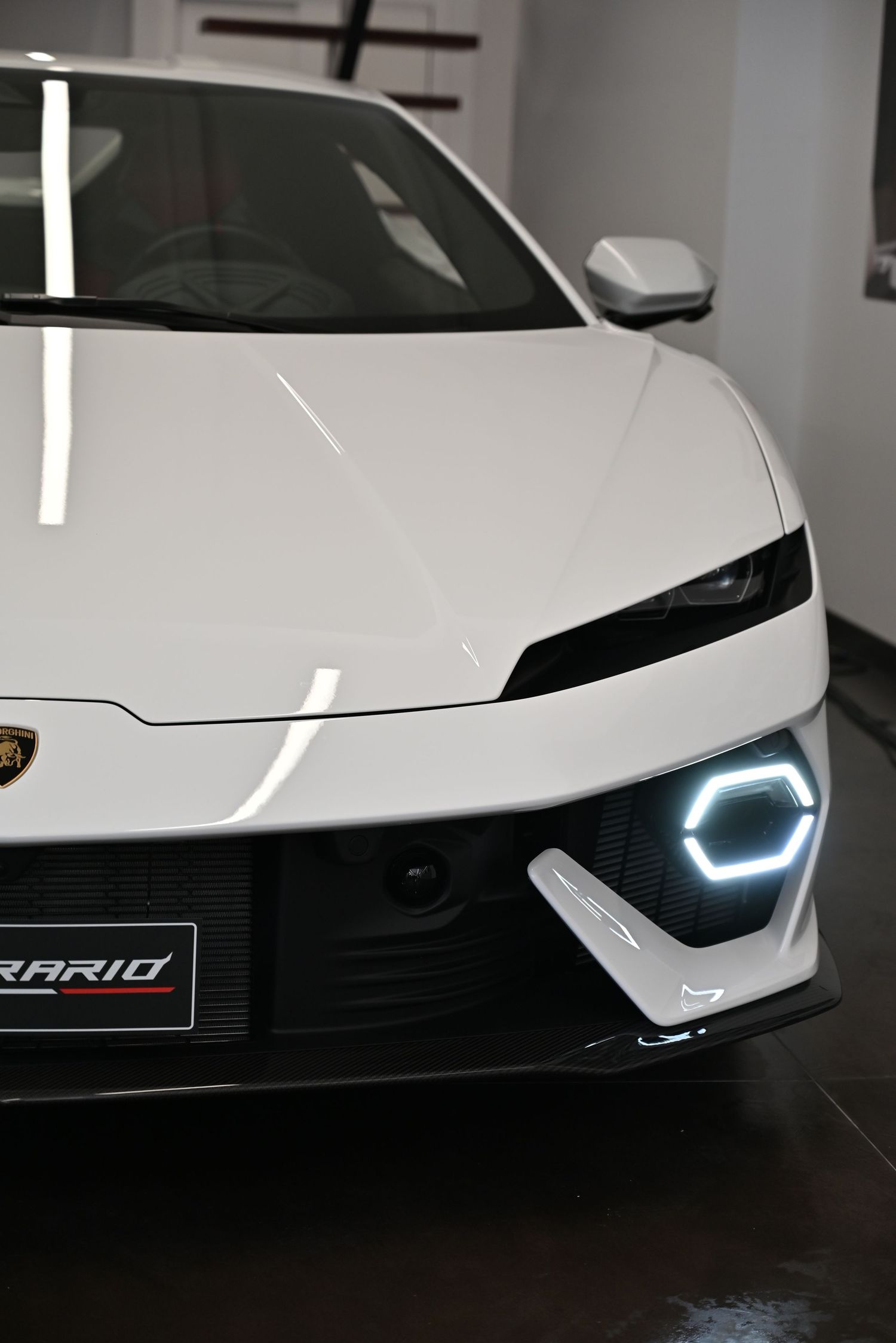 Close-up on the glossy bodywork, reflecting luxurious finish and precise details.