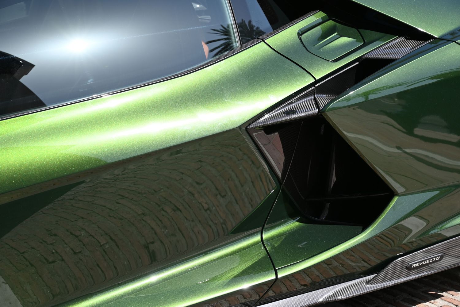 Close-up of the glossy bodywork, highlighting luxurious finishes and precise design.