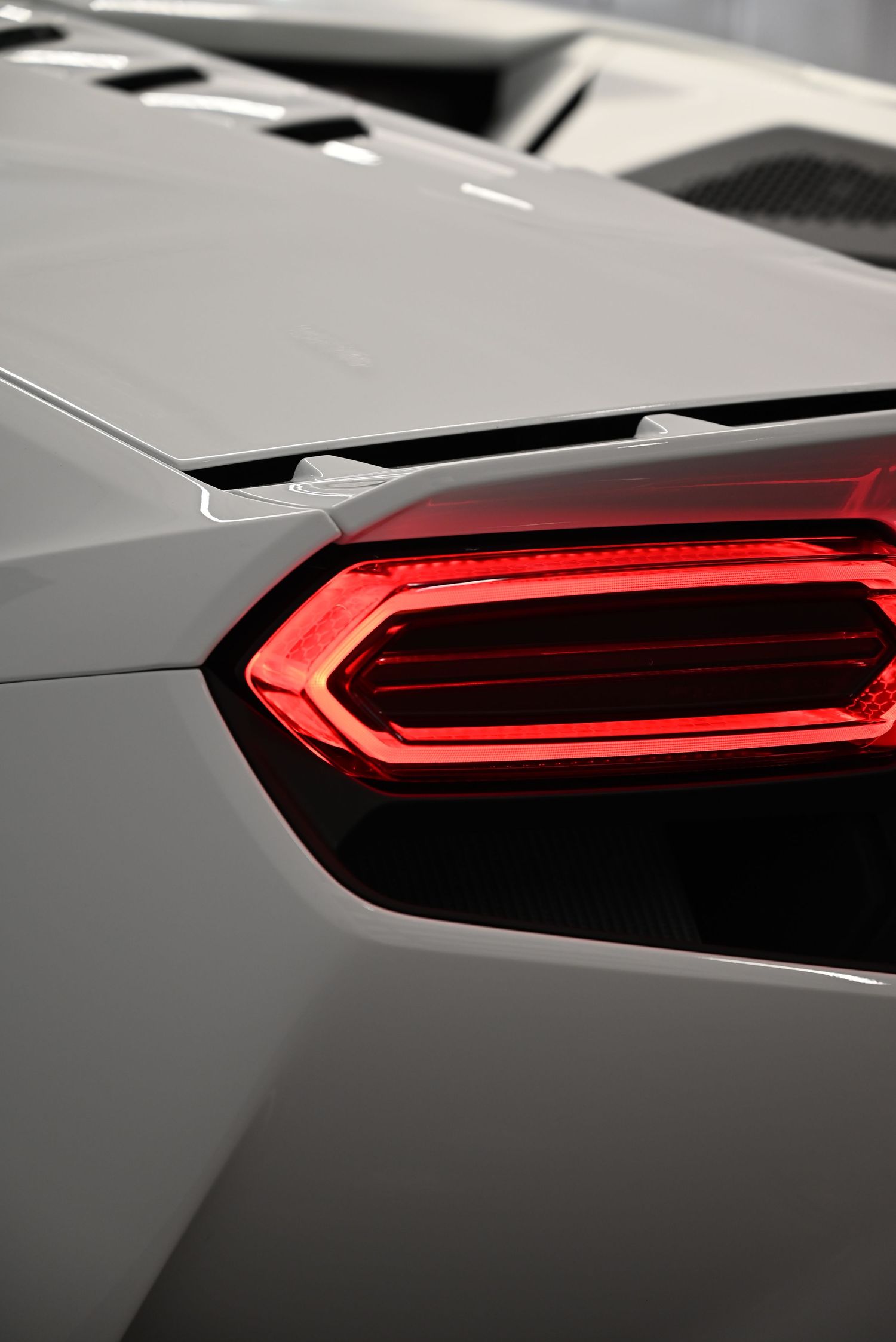 The rear lights and aerodynamic details emphasize the car’s power and elegance.