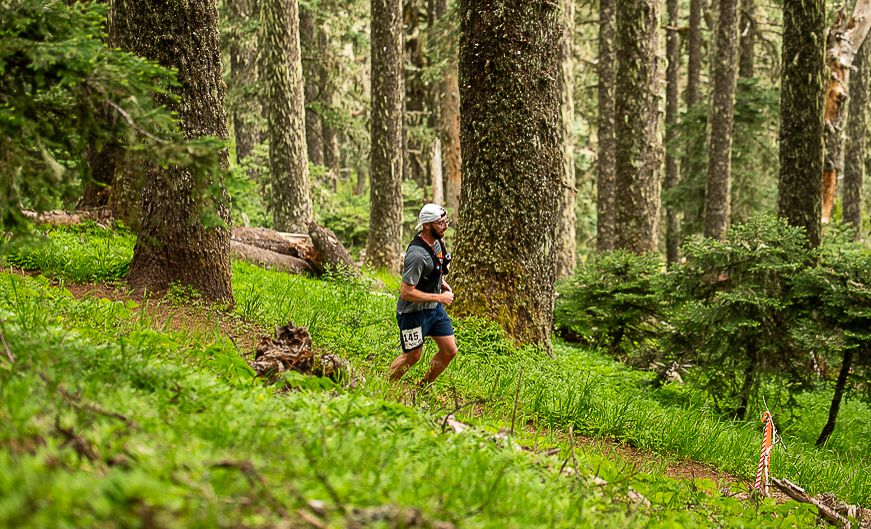 Trail runner racing Mary's Peak ultra marathon hosted by Mudslinger events and photographed by Mike Norton photography.