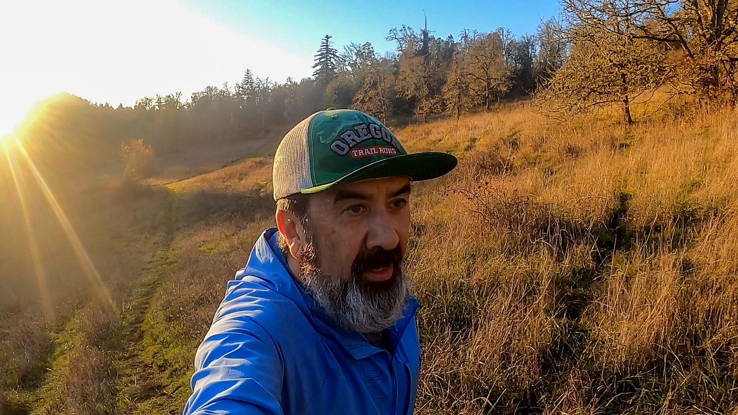 Trail runner on Mount Pisgah Oregon running at sunset.