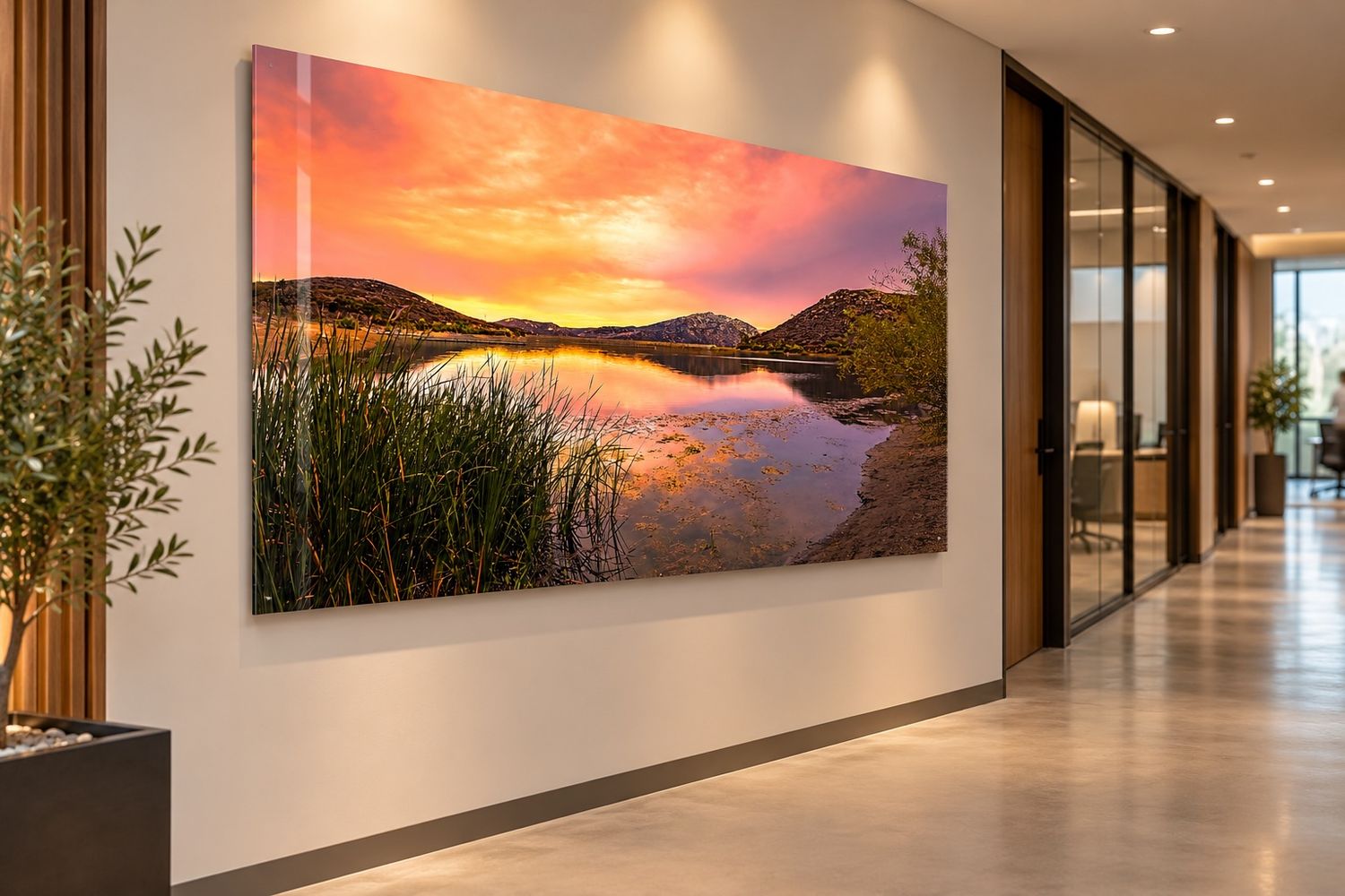 Landscape image mock up of a sunrise, lake and mountains in an modern office hallway.