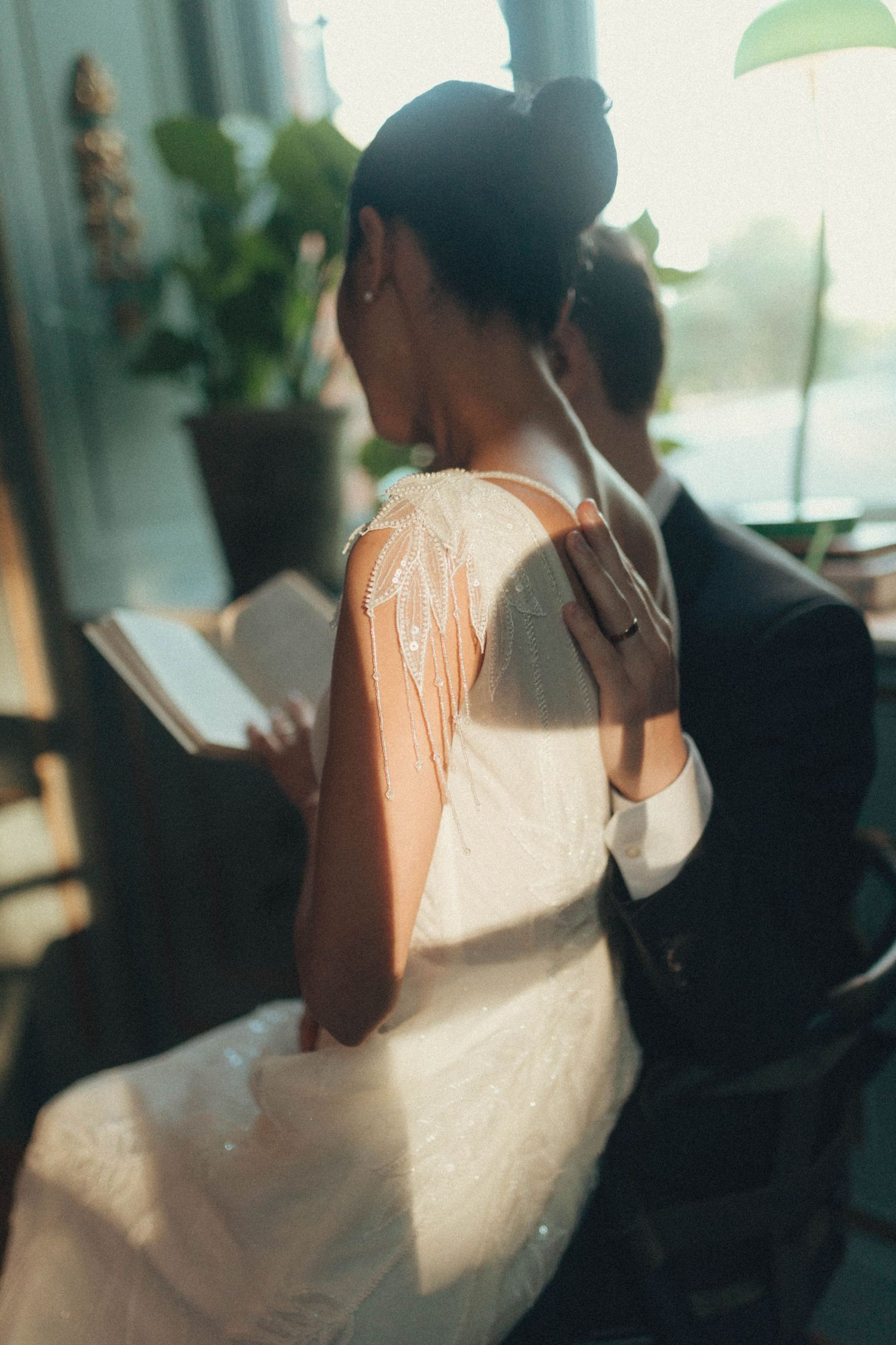 A series of blurred profile silhouettes in warm lighting creating an artistic abstract composition.