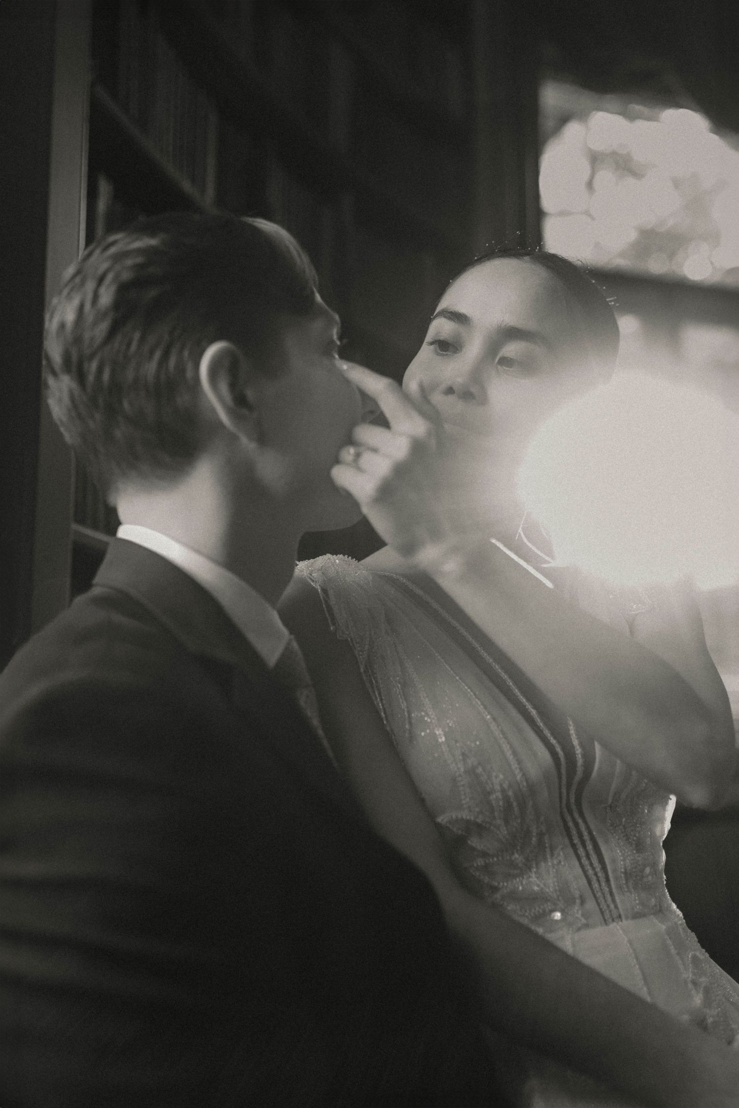 A black and white sequence of frames showing cigarette smoke drifting through the air in a dark setting.