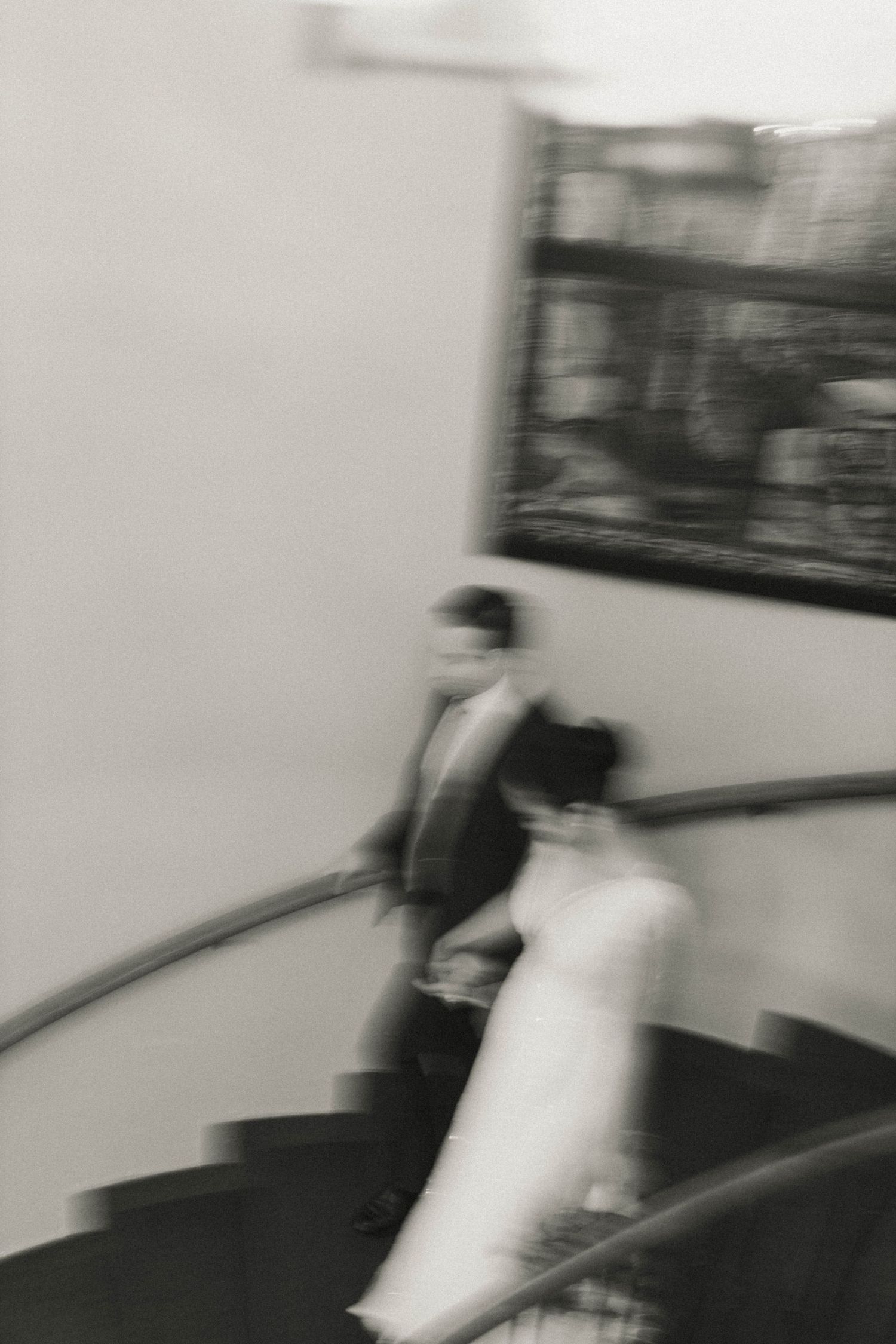 A blurry motion sequence shows a pillow fight in progress with figures swinging white pillows in an indoor space.