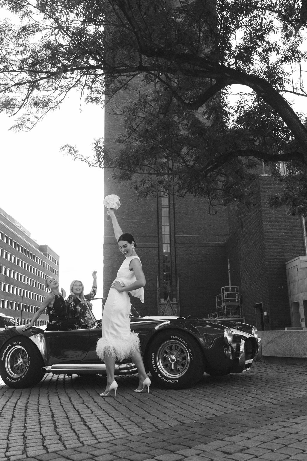 A series of vintage black and white photographs showing a classic car and people on a cobblestone street.