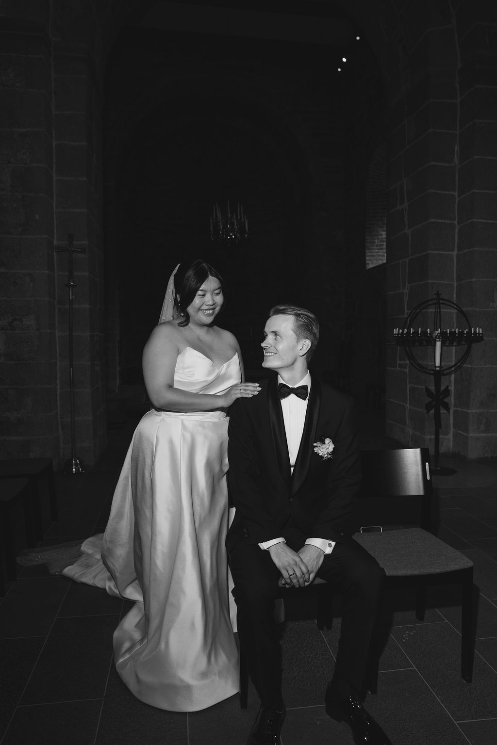 A black and white photo sequence captures a couple dancing together at what appears to be a formal event.