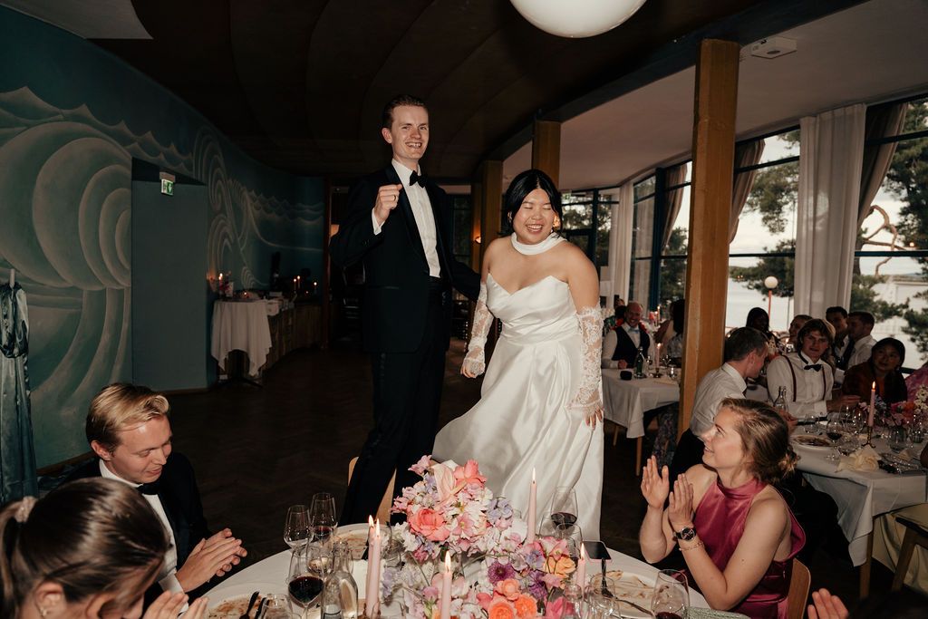 A series of candid wedding reception photos showing guests dancing and celebrating in an indoor venue.