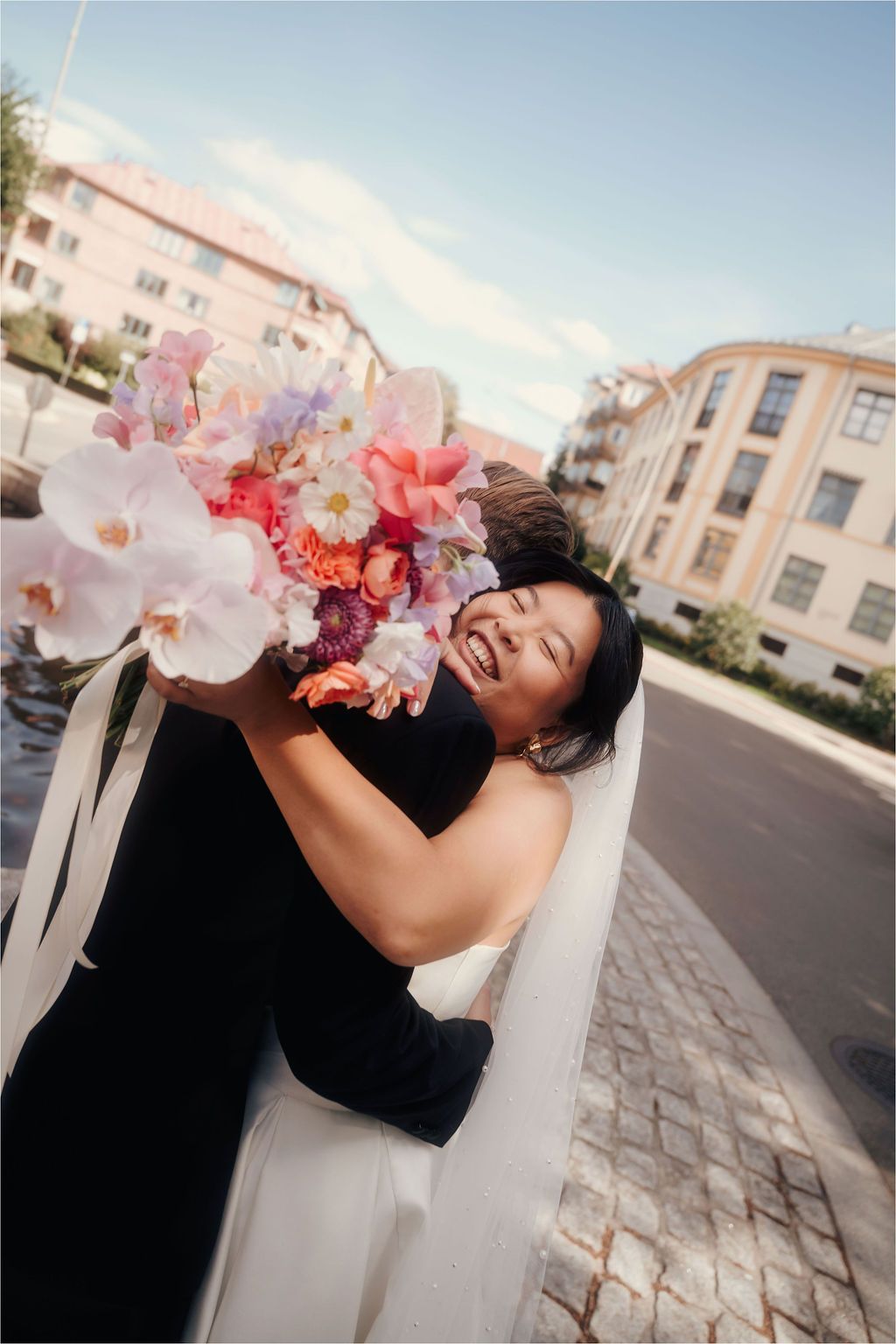 A creative wedding photography sequence showing playful poses with a floral bouquet against an urban backdrop.