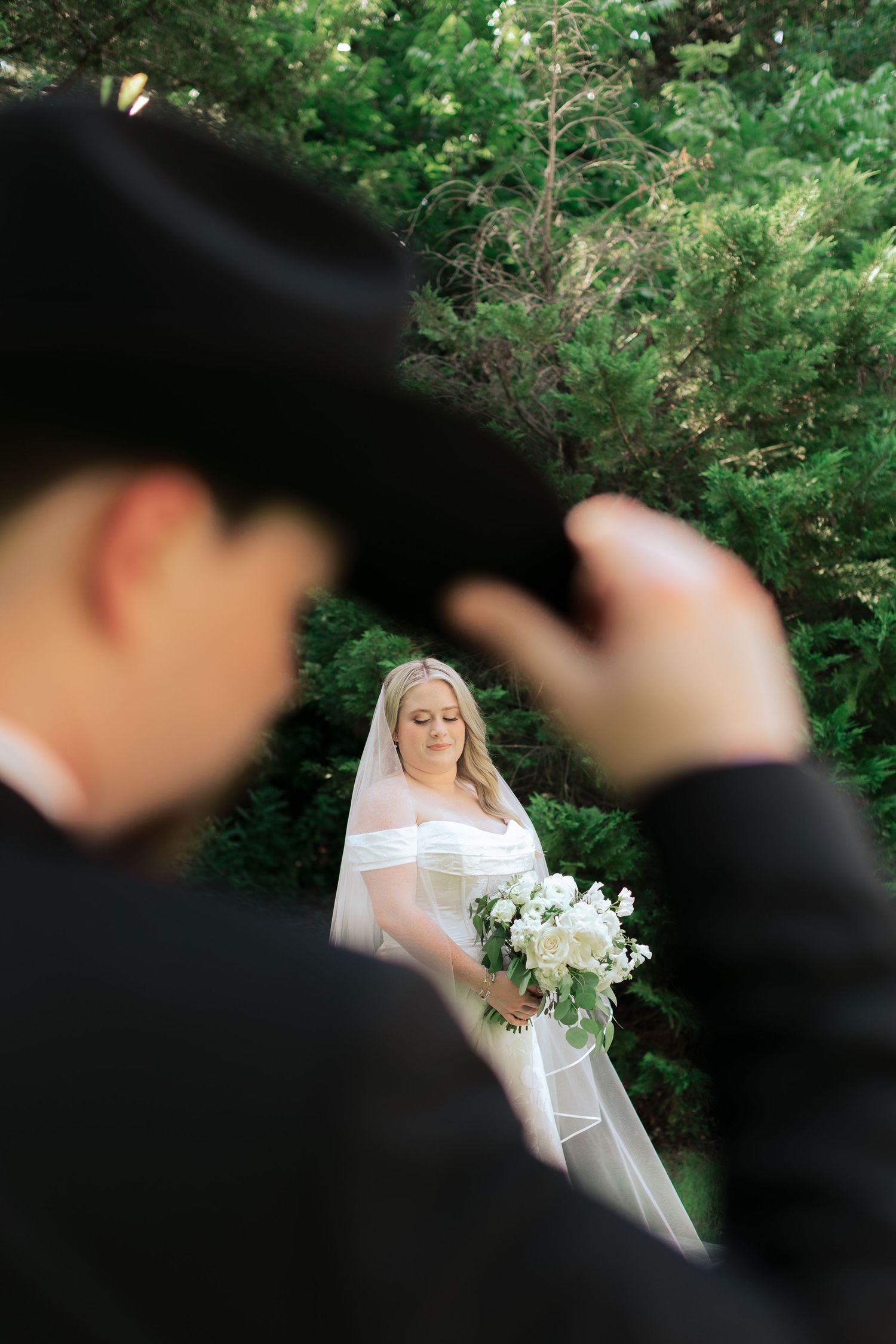 Artistic wedding photography sequence with silhouettes against a lush green garden backdrop.