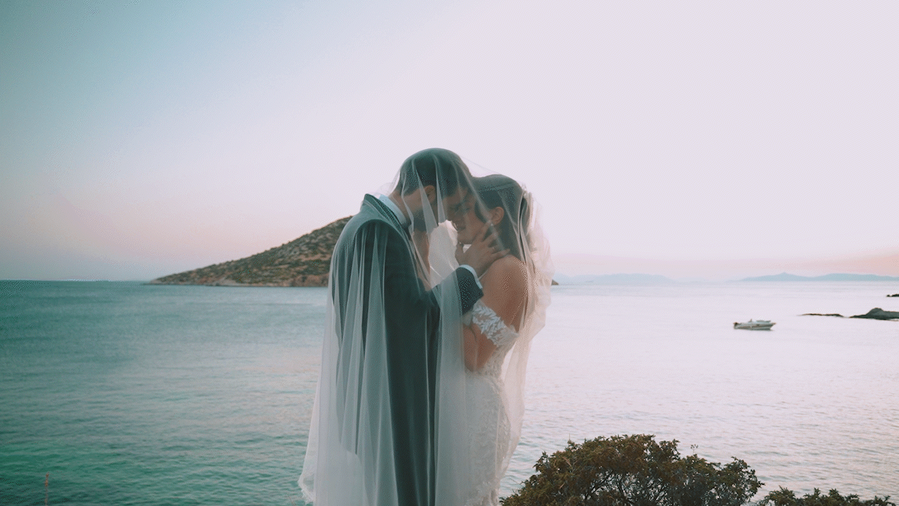 Groom and Bride, Kissing couple, cinematic shot, artsy, sea landscape.