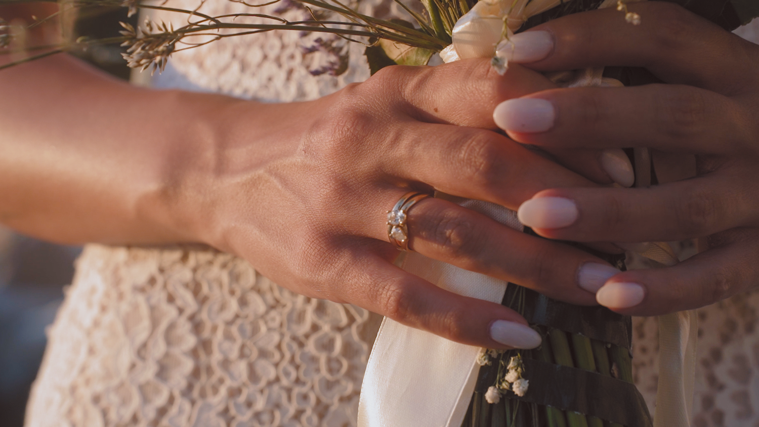 Bride's hand, ring, holding boquet, cinematic