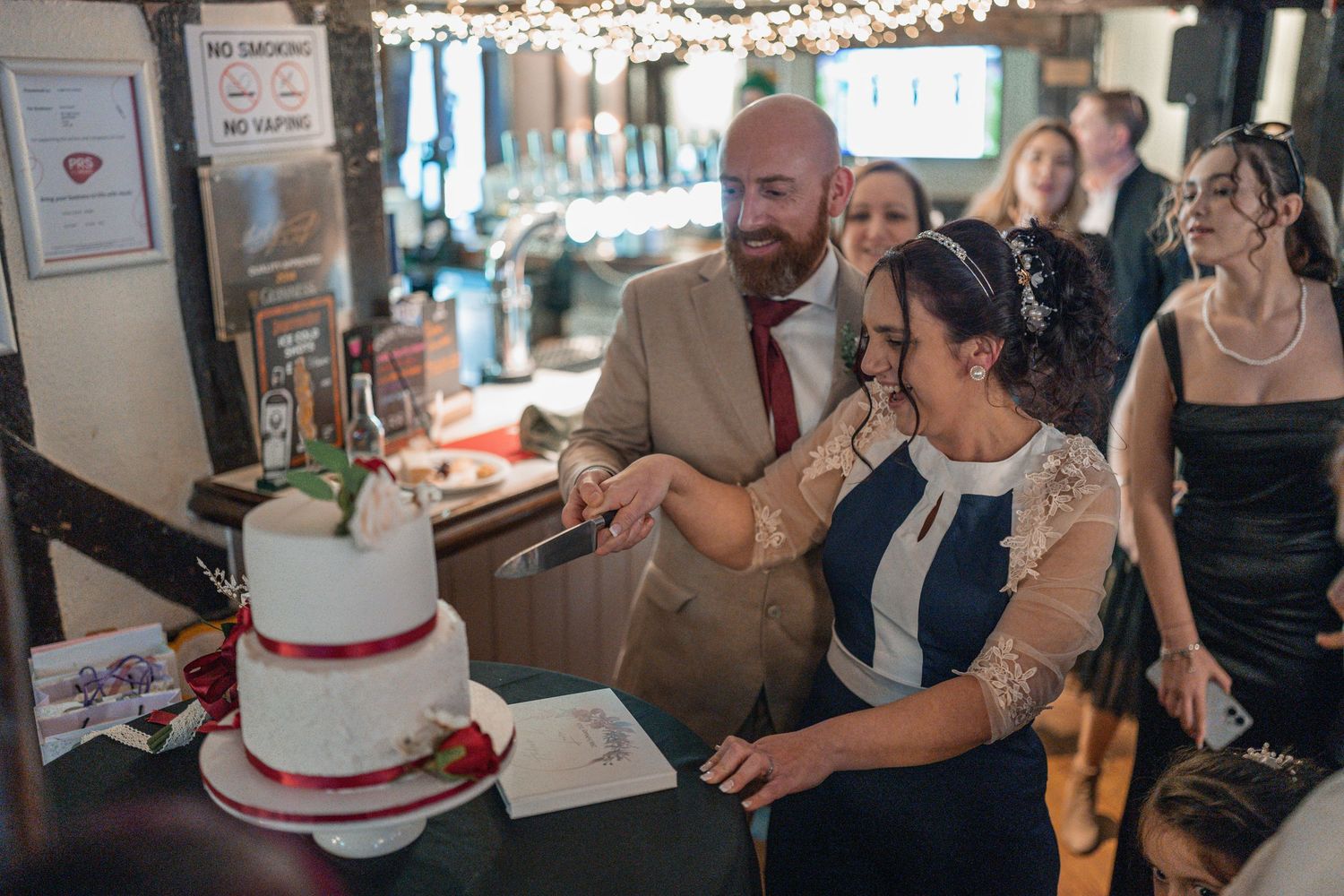 essex bride and groom cutting cake wedding