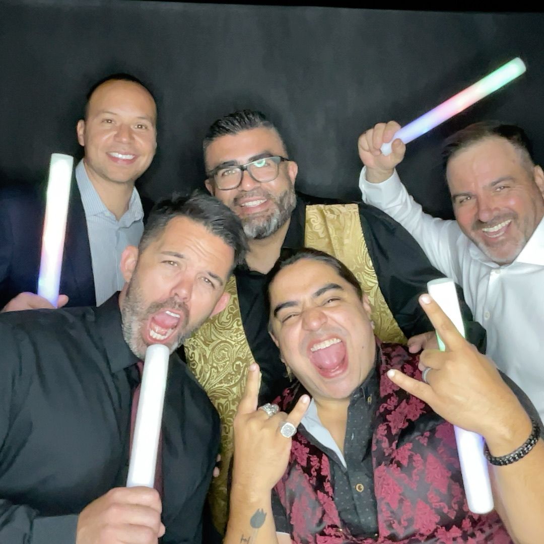 Guests posing in the Twist Photo Booths photo booth at the Carlos Rosales event in Phoenix, AZ