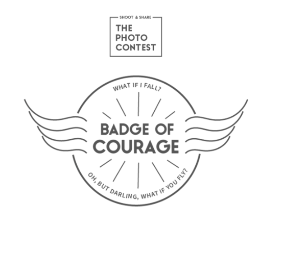 Minimalist winged badge design with text 'Badge of Courage' for a photo contest.
