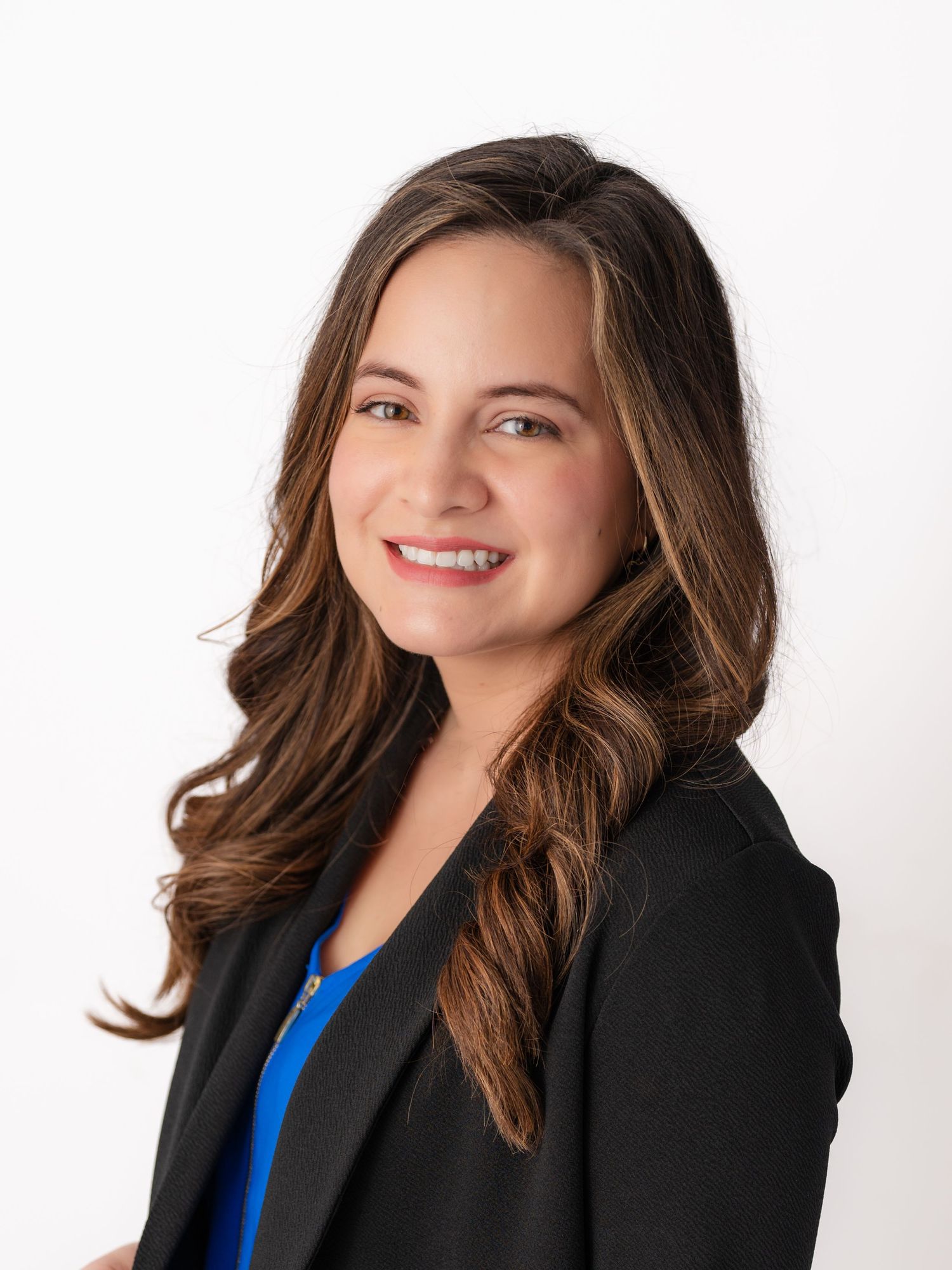 Professional wearing a black blazer and blue top poses against white background in three headshot variations.