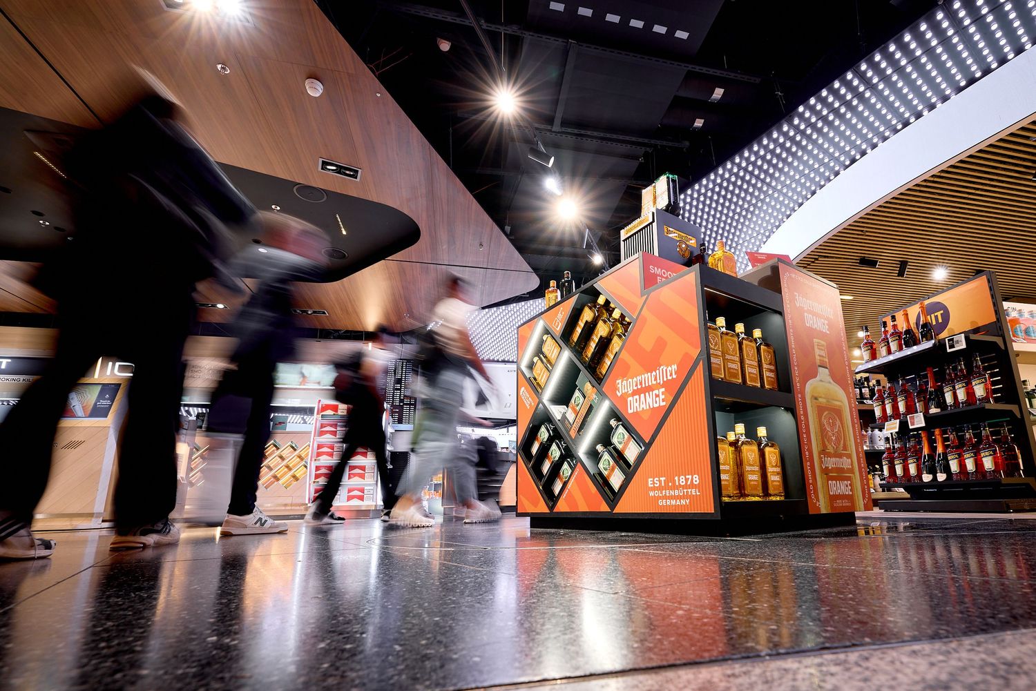 Travel retail airport activation photography for Jagermeister Orange at Zurich duty free store