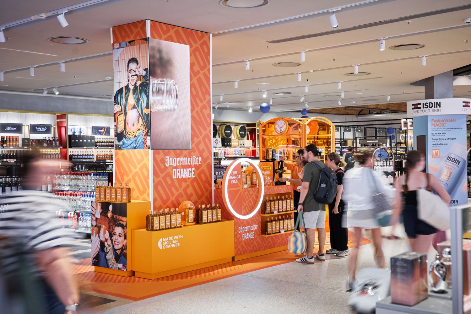 Travel retail airport activation photography for Jagermeister Orange at Barcelona Avolta duty free store
