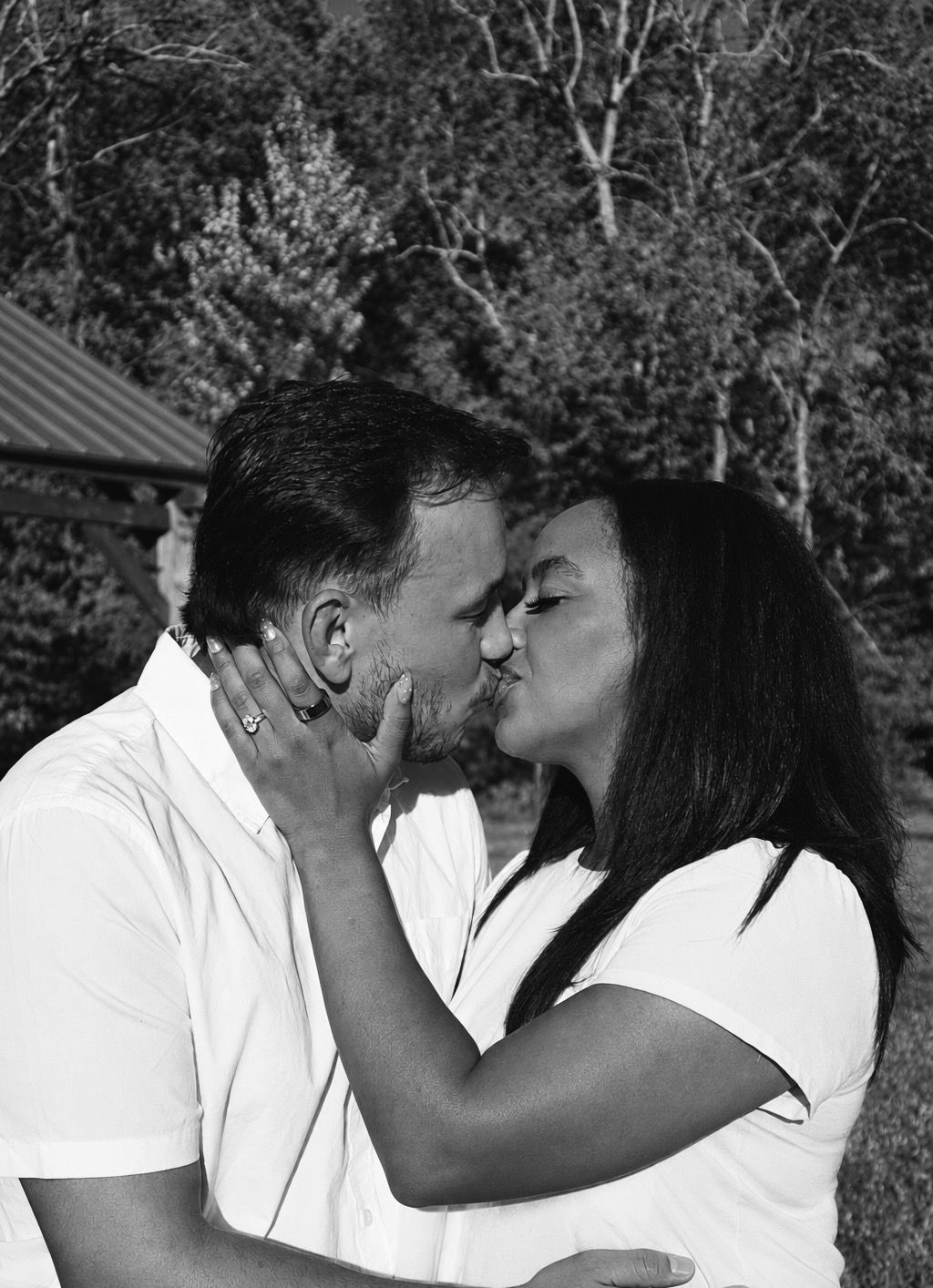 Couple kissing for engagement video