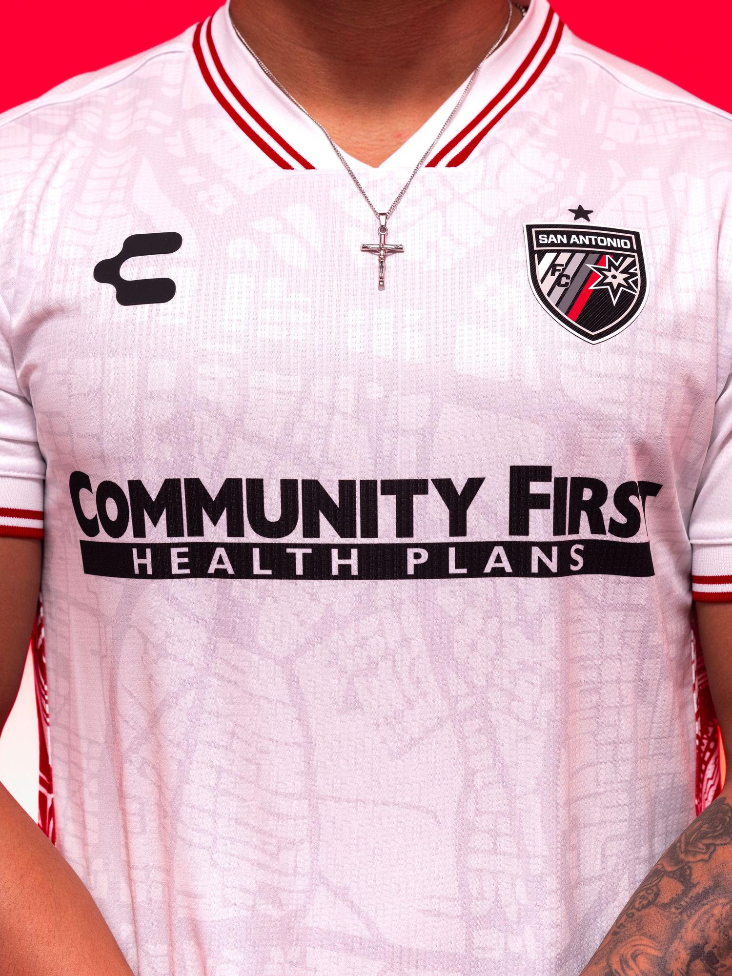 San Antonio FC white Charly jersey with Community First Health Plans sponsor, featuring red trim and club crest.