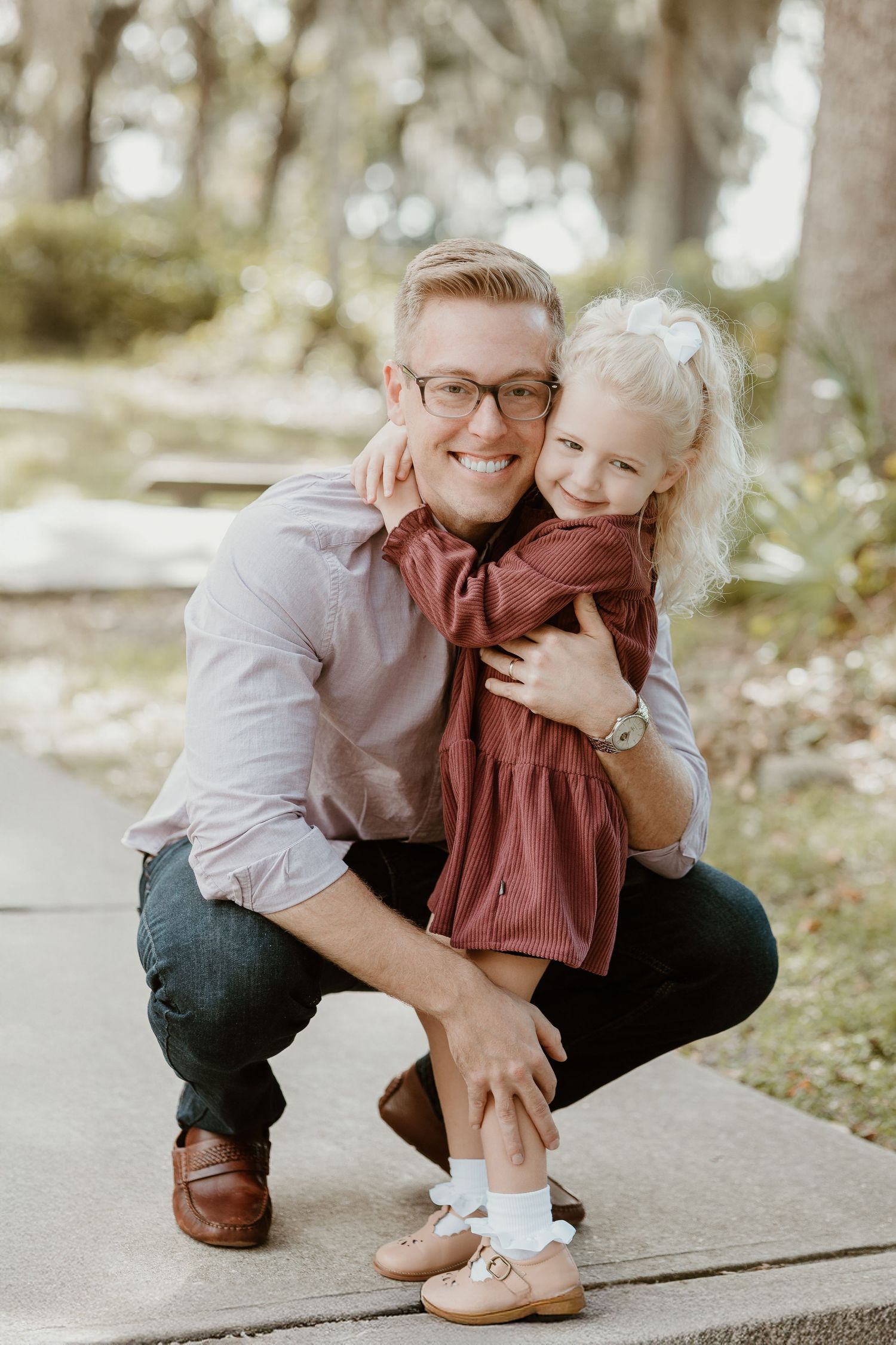 Heartwarming outdoor portrait showing joyful interaction in natural setting.