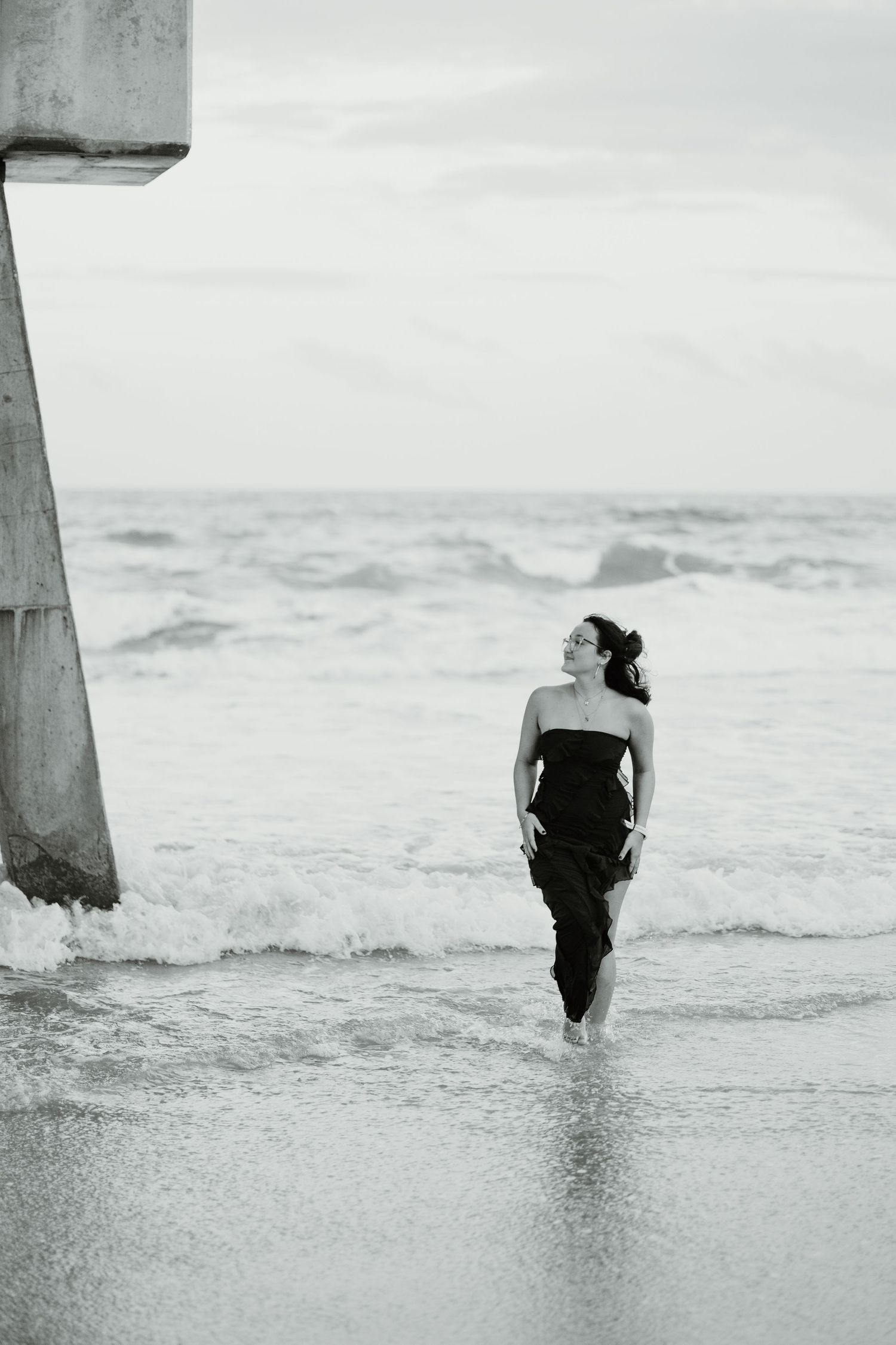 Black and white ocean photography sequence showing silhouette wading into waves.