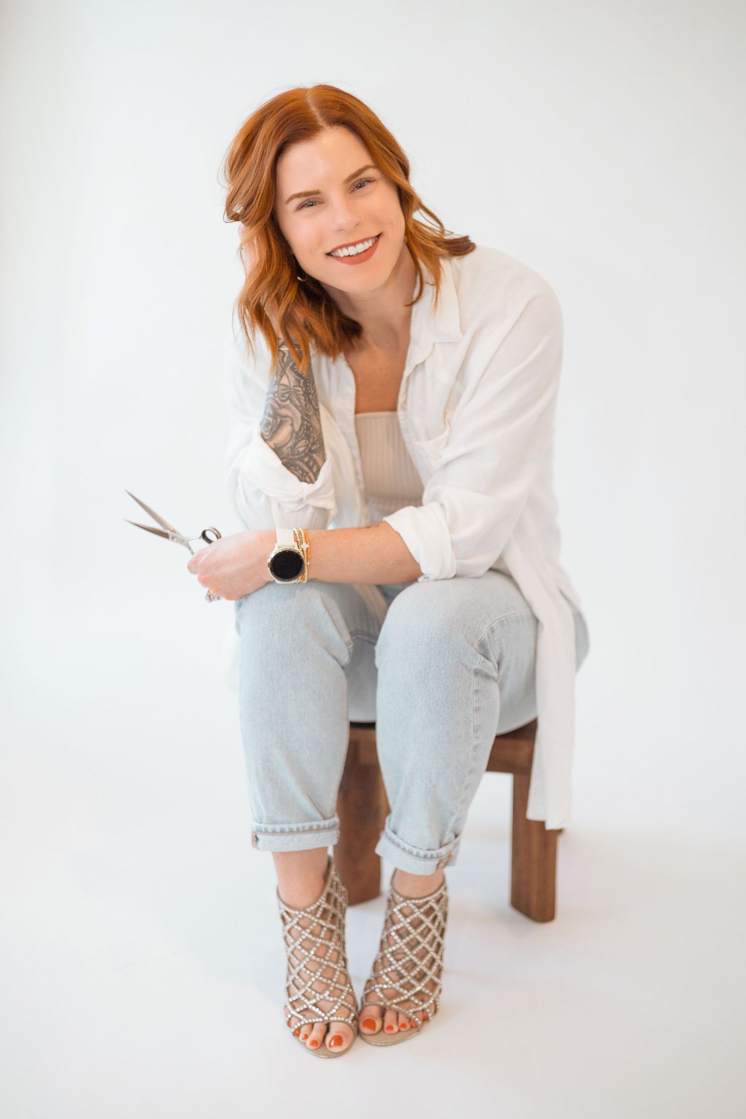 Casual portrait session featuring white button-down shirt and light wash denim.