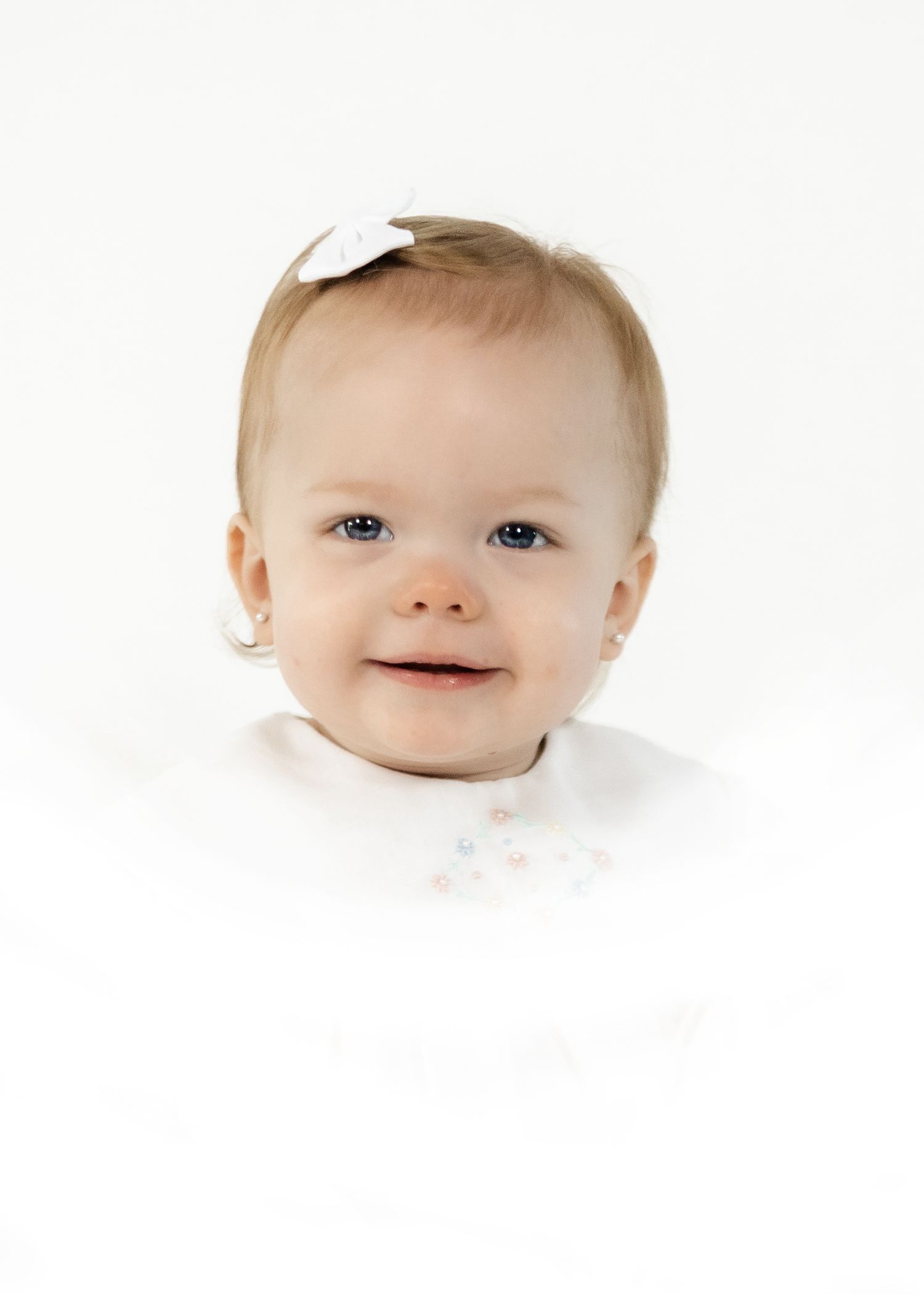 Close-up studio portrait against pure white background.