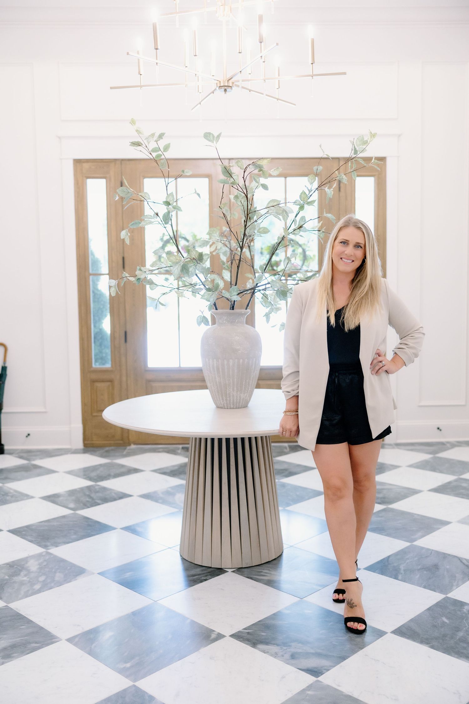 Interior design photo series showing a modern entryway with black and white checkered floors and a decorative pedestal vase.
