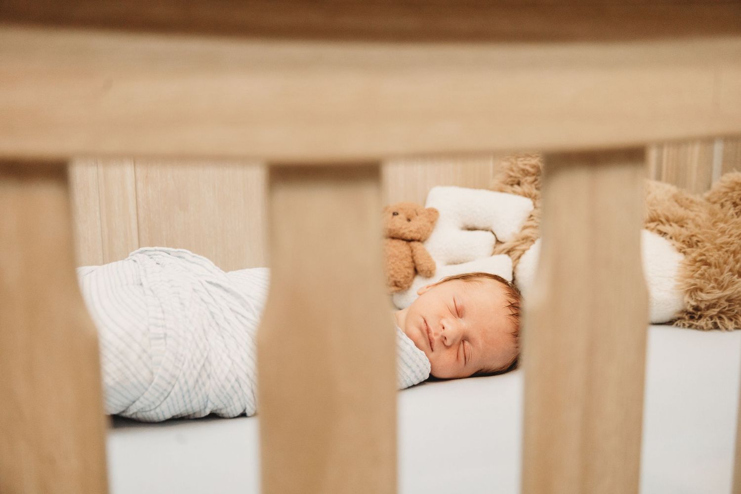Close-up view of baby items and nursery details in warm tones.