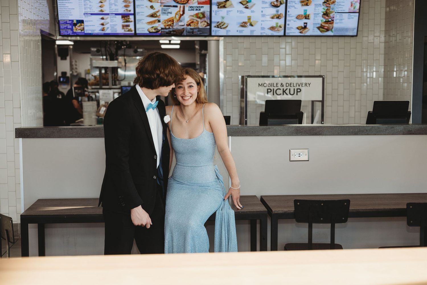 Inside a Taco Bell restaurant with menu boards and ordering counter.