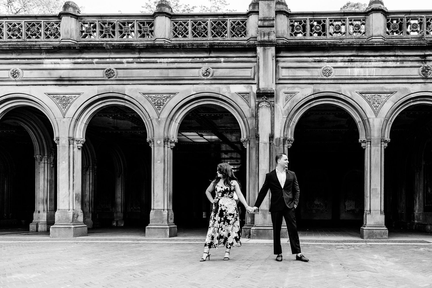 Historic architectural detail of ornate stone arches and columns in black and white.