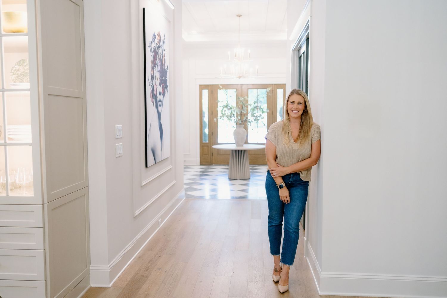 Bright white hallway interior with modern architectural details and natural lighting.