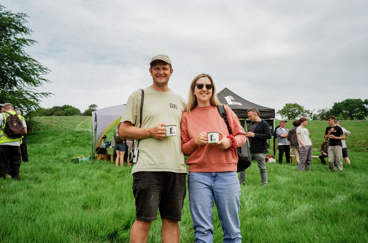 ryan goold photography and his wife abbie smiling for the camera during an event in cornwall