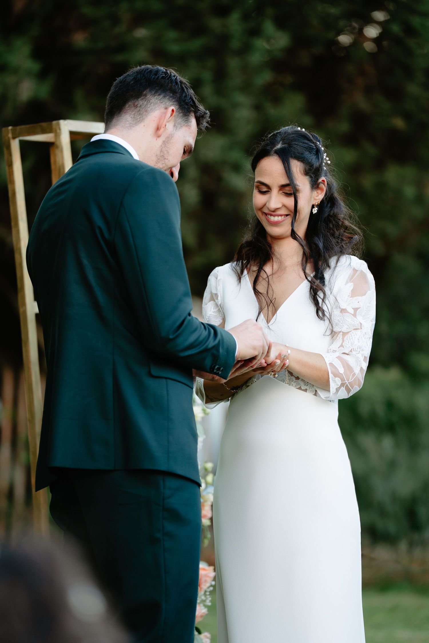 A series of intimate wedding moments captured showing a couple exchanging rings during their outdoor ceremony.