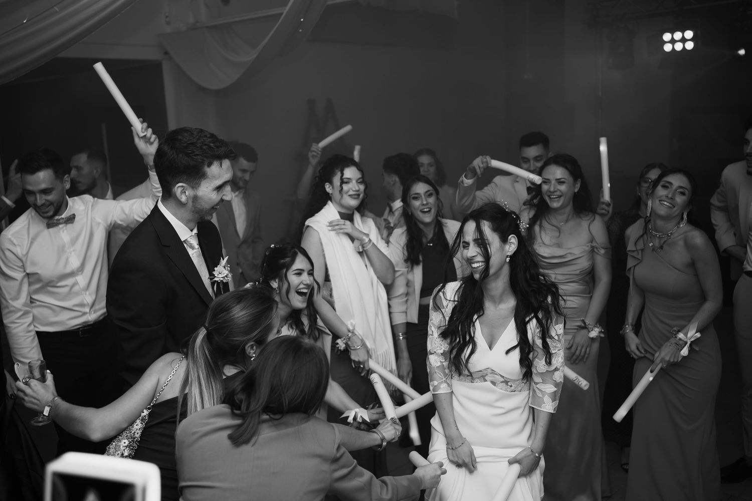A group of people dancing and having fun at a lively party or celebration event.